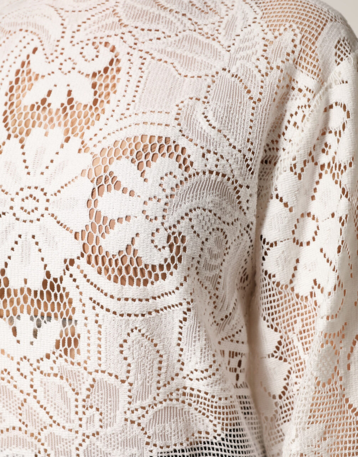 Elevate your wardrobe with the Dolce & Gabbana White Embroidery Lace Cotton Blouse Top, a masterpiece of Italian craftsmanship that embodies timeless elegance and refined femininity.
