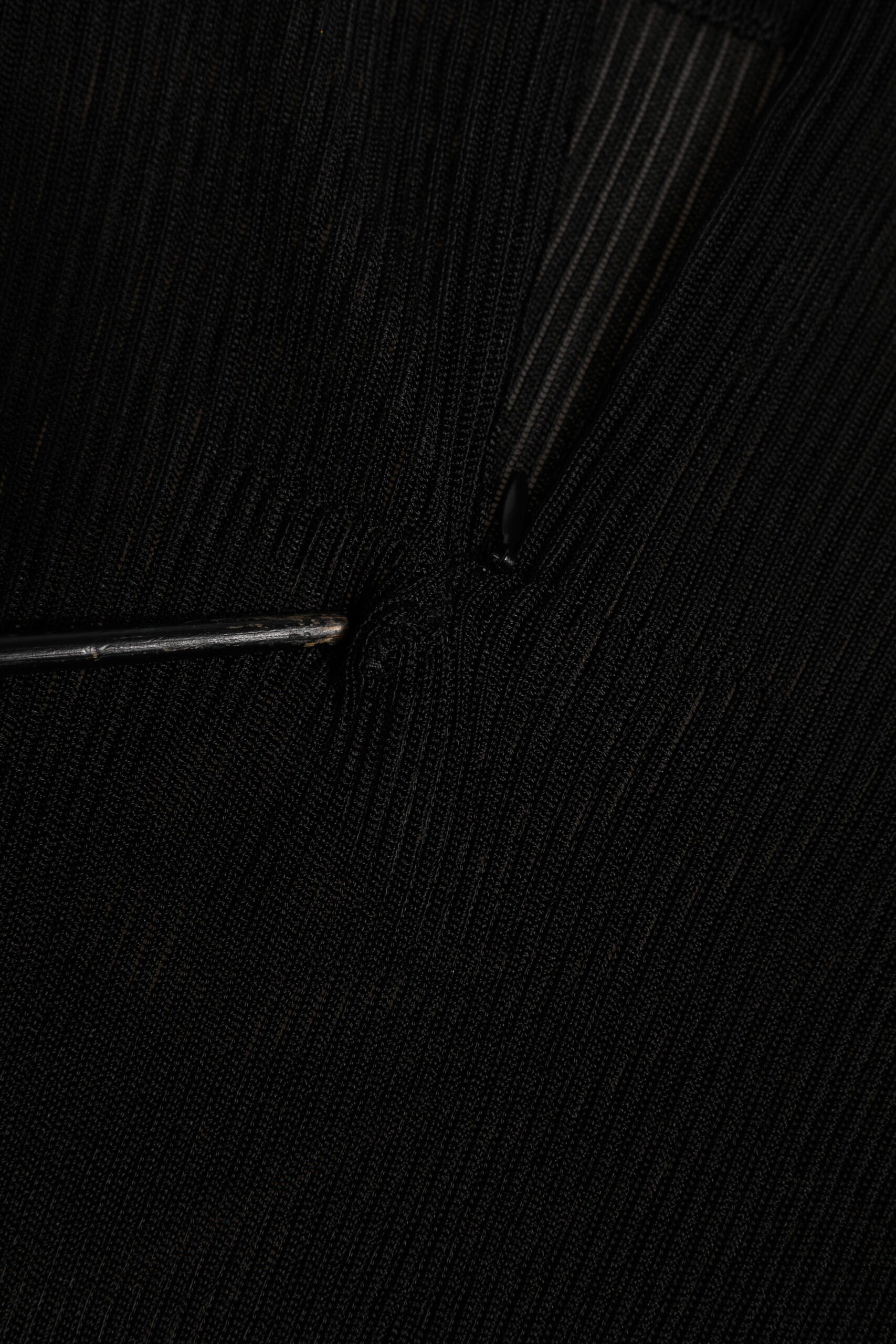 Indulge in the elegance of the Dolce & Gabbana Black Viscose Turtle Neck Pullover Top, a masterpiece of Italian craftsmanship that embodies timeless sophistication and luxurious comfort.