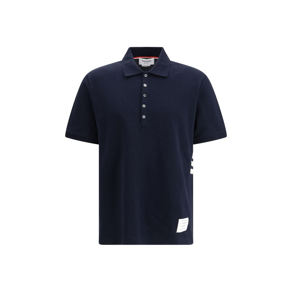 Indulge in the Thom Browne Blue Cotton Polo Shirt from the SS26 collection, a masterpiece of craftsmanship that redefines luxury and sophistication for the discerning individual.