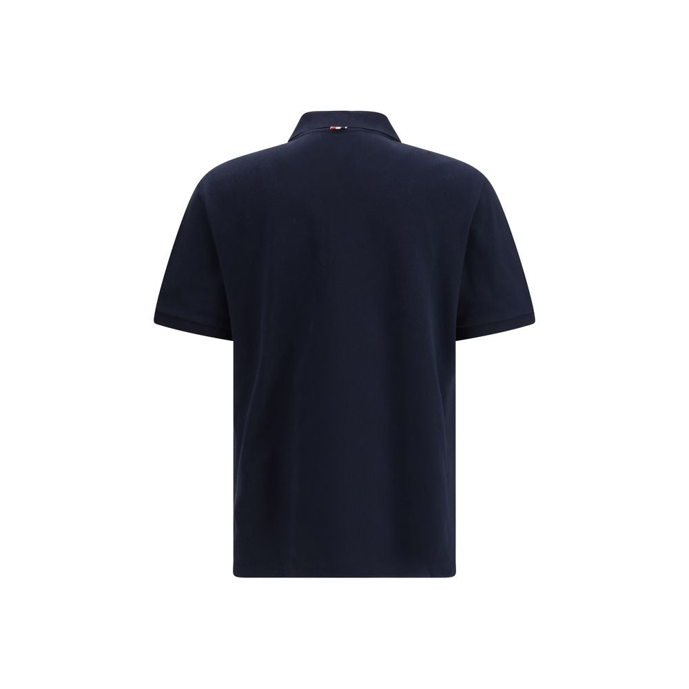 Discover the Thom Browne Blue Cotton Polo Shirt from the SS26 collection, a luxurious blend of timeless elegance and modern sophistication, crafted for the discerning individual.