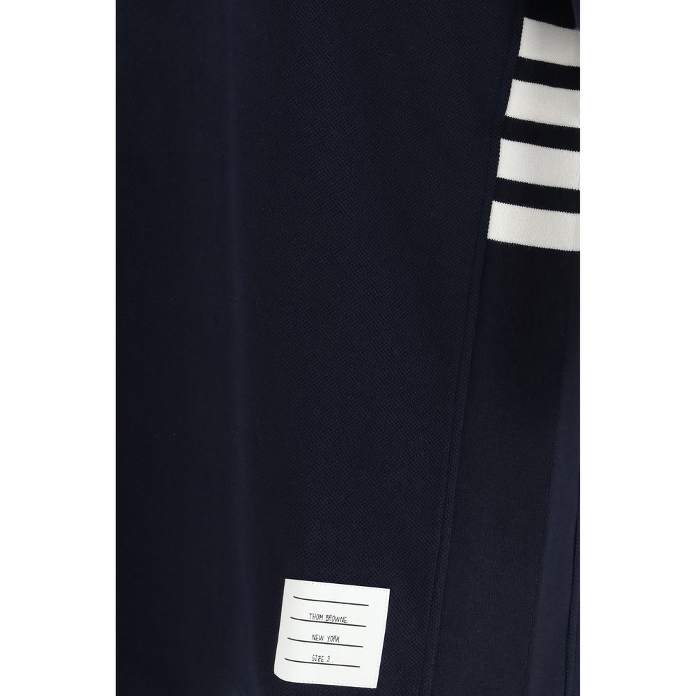 Elevate your wardrobe with the Thom Browne Blue Cotton Polo Shirt from the SS26 collection, a luxurious blend of timeless elegance and modern sophistication.