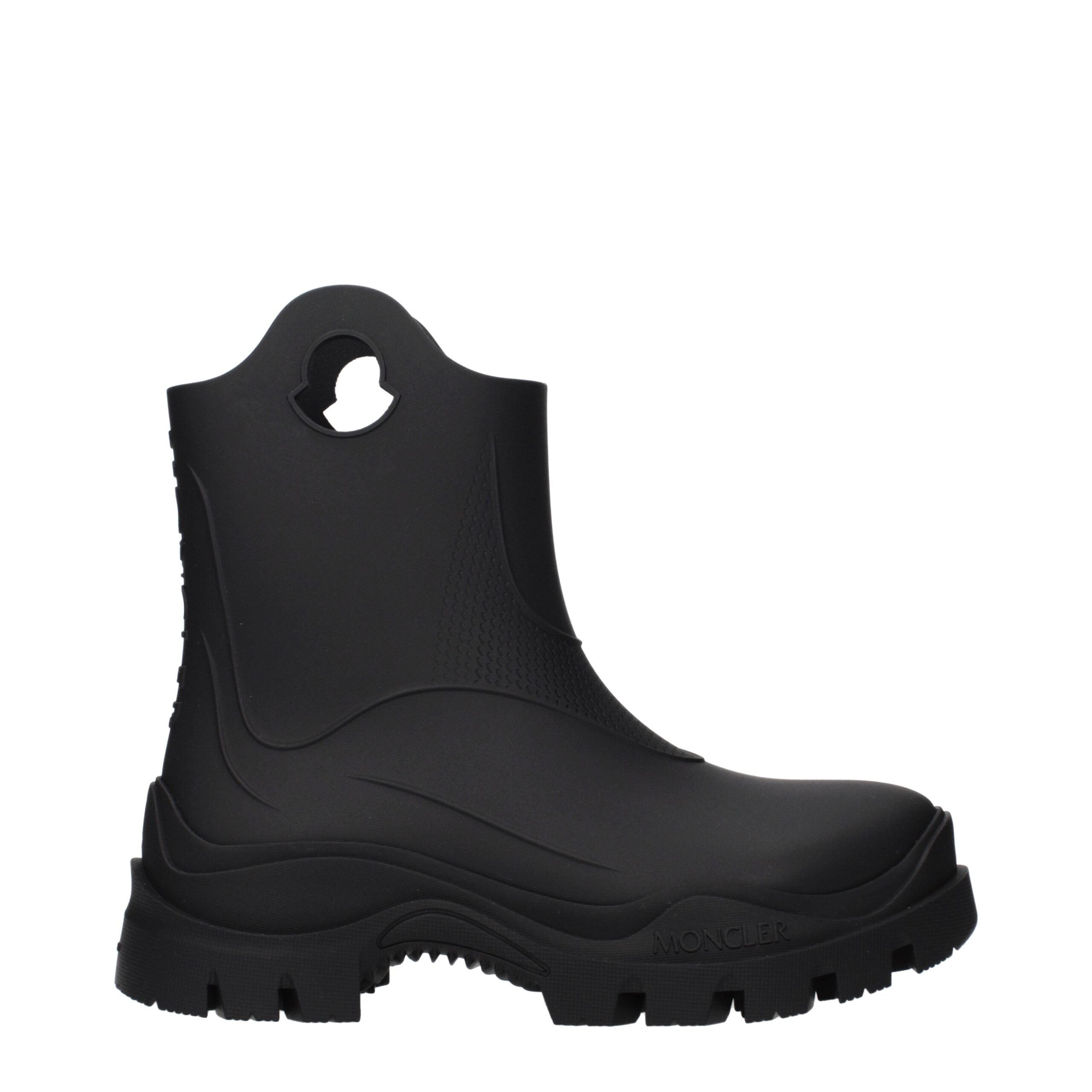 Experience the exquisite artistry of Moncler Black Cotton Ankle Boots, crafted from premium rubber for timeless elegance and versatility in every step.