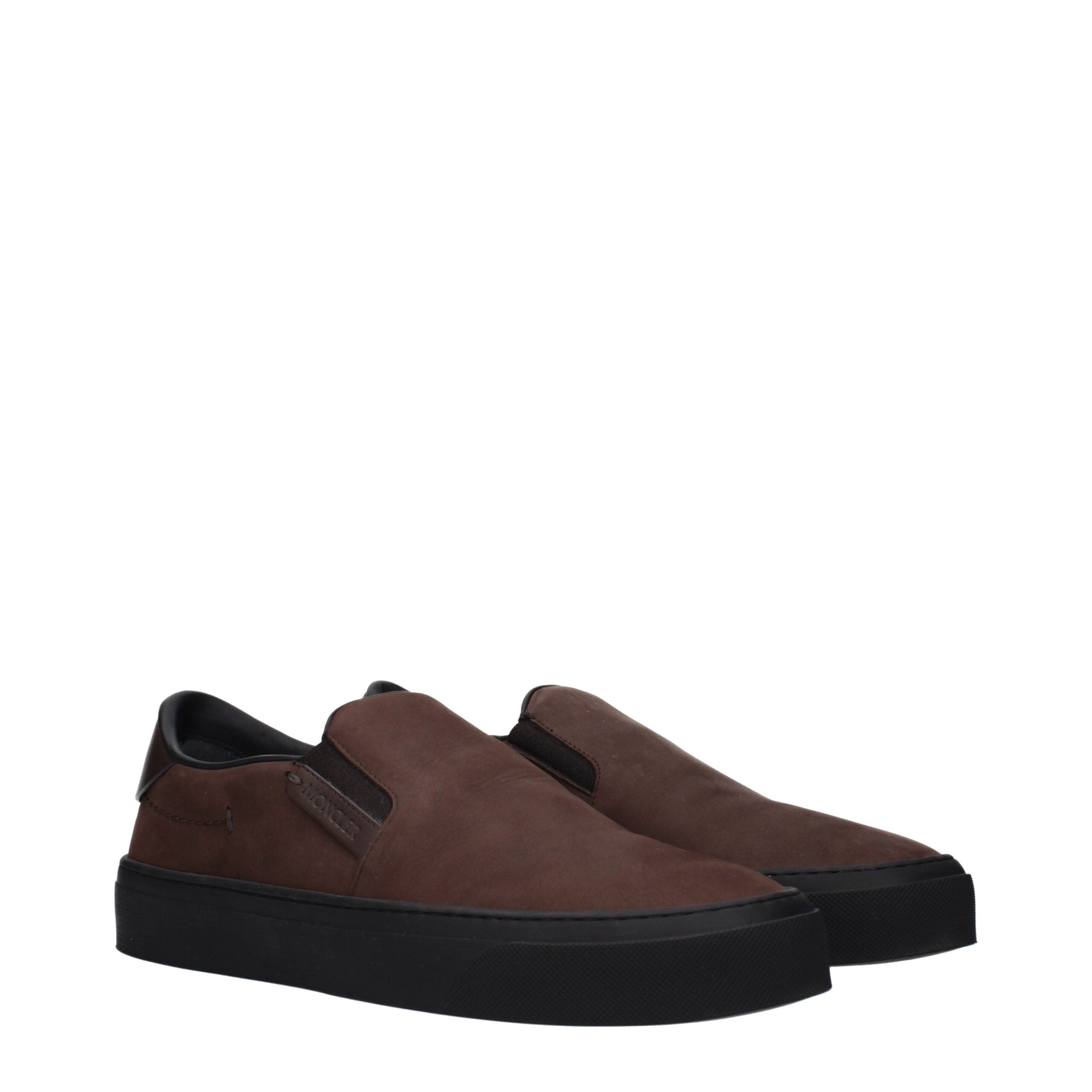 Experience the exquisite Moncler Brown Leather Slip-On Loafers, where artisanal craftsmanship meets timeless elegance, perfect for the discerning individual.