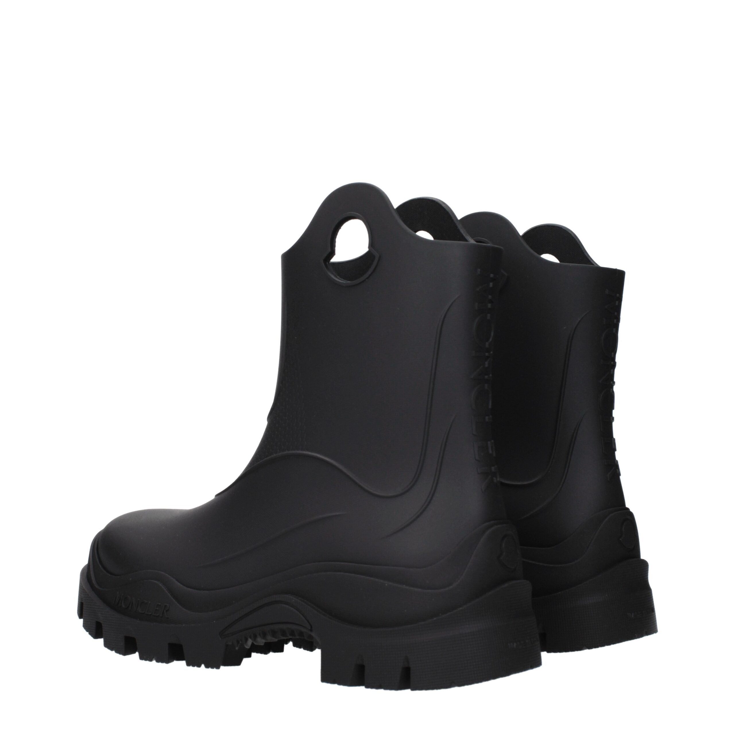Experience the exquisite artistry of Moncler Black Cotton Ankle Boots, where luxurious black rubber meets timeless elegance, perfect for the discerning fashion connoisseur.