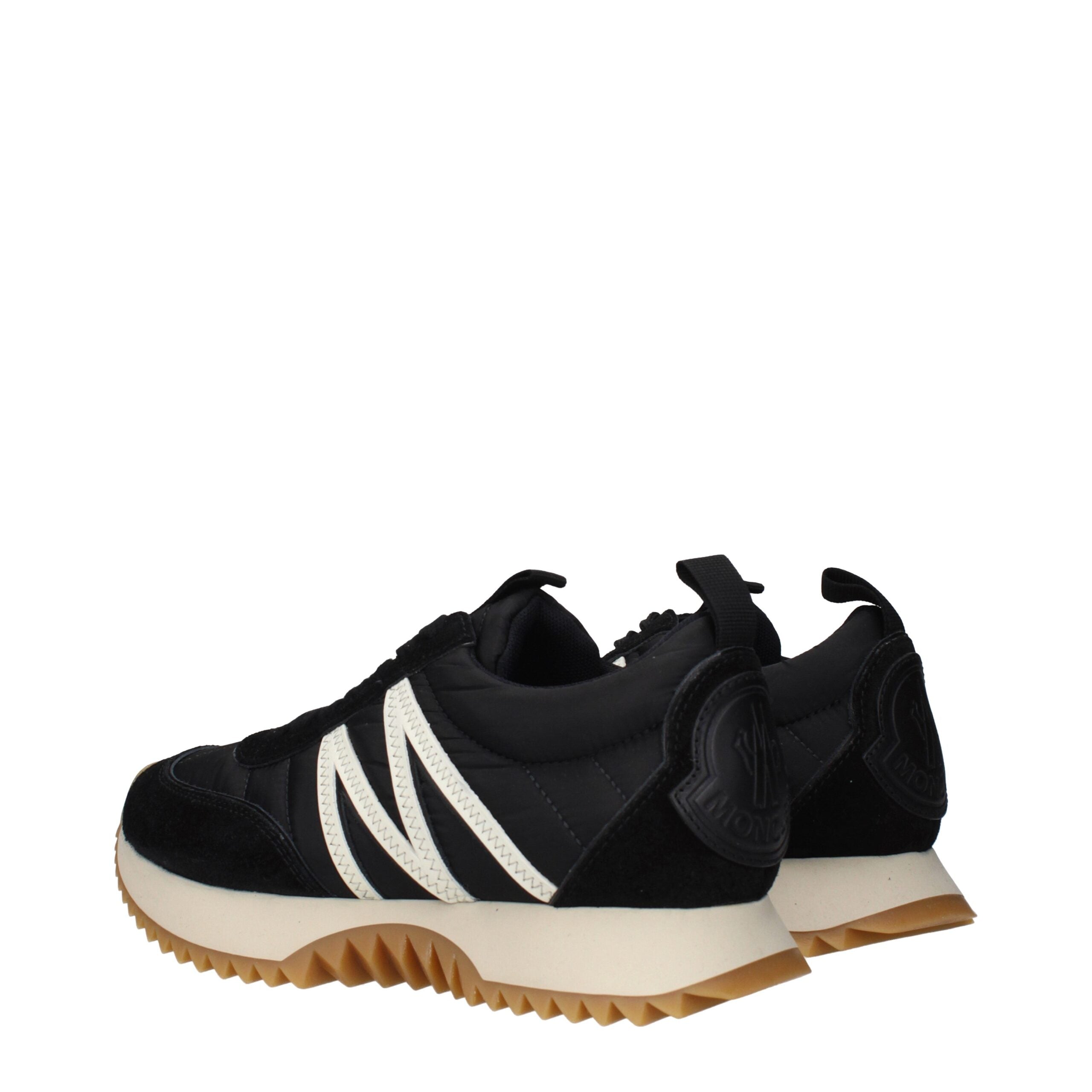 Step into a realm of elegance with Moncler Black Fabric Low Top Sneakers, where exquisite craftsmanship meets luxurious design, redefining your style for any occasion.