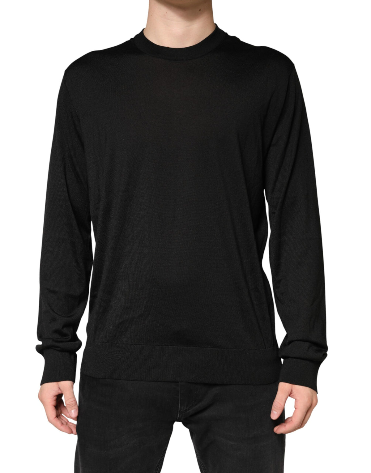 Indulge in the exquisite Dolce & Gabbana Black Silk Men Crew Neck Pullover Sweater, a masterpiece of Italian craftsmanship that embodies luxury and sophistication.