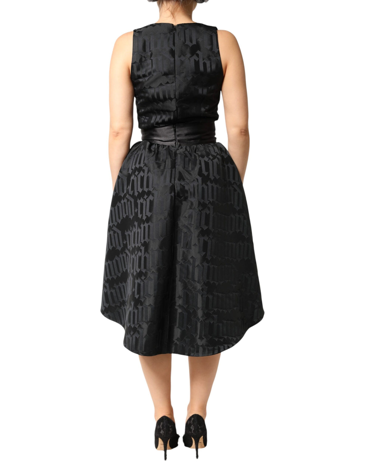 Indulge in the allure of the John Richmond Black Jacquard Deep V-neck Sleeveless Dress, a masterpiece of Italian craftsmanship, perfect for those who embrace elegance and sophistication.
