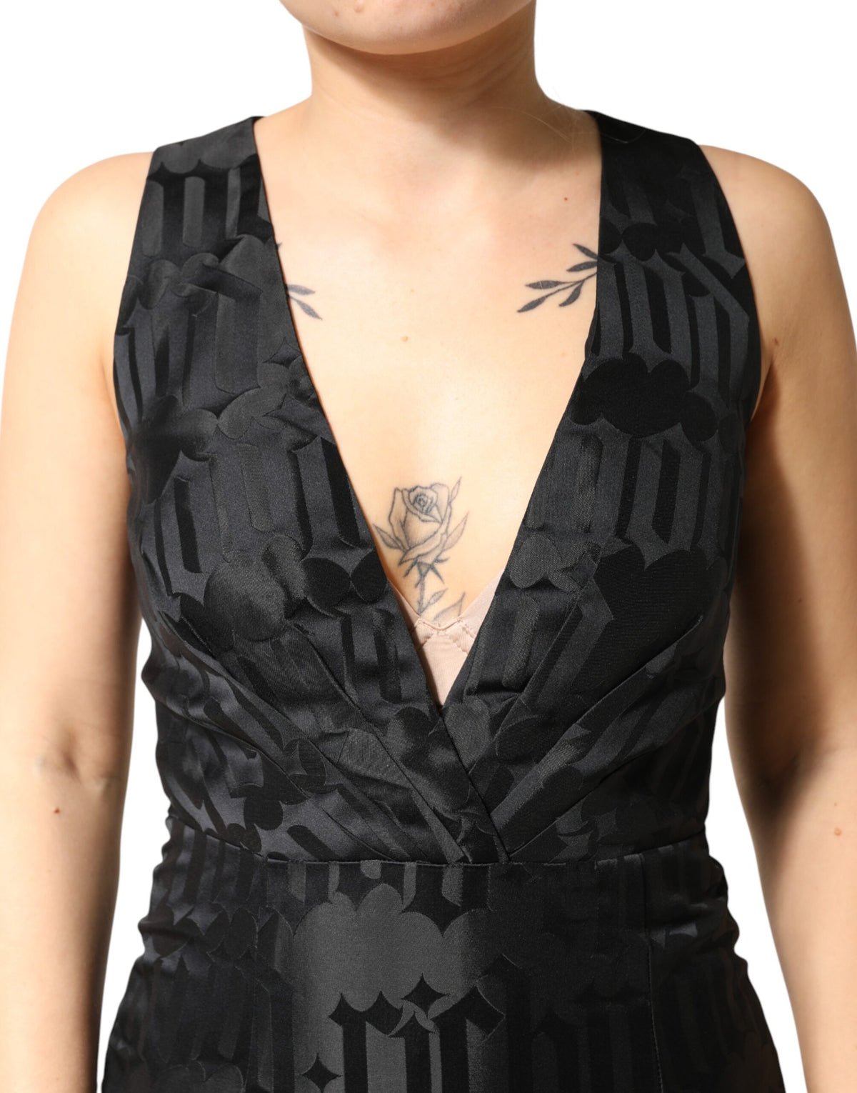 Indulge in the exquisite craftsmanship of the John Richmond Black Jacquard Deep V-neck Sleeveless Dress, a timeless piece that embodies luxury and sophistication for any elegant occasion.
