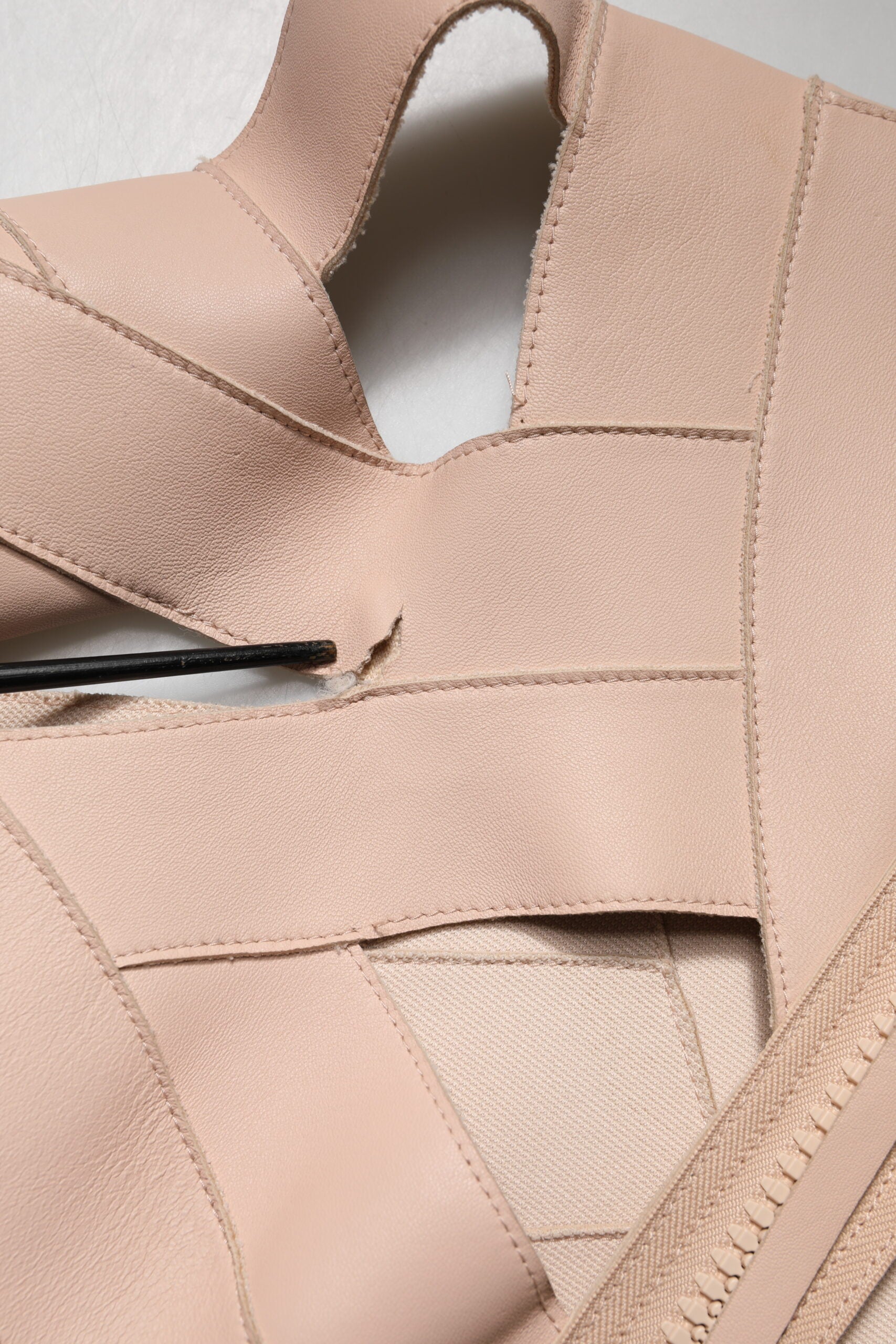Indulge in the timeless elegance of the Dsquared² Beige Leather Short Sleeves Sheath Mini Dress, a masterpiece of Italian craftsmanship that redefines luxury and allure.