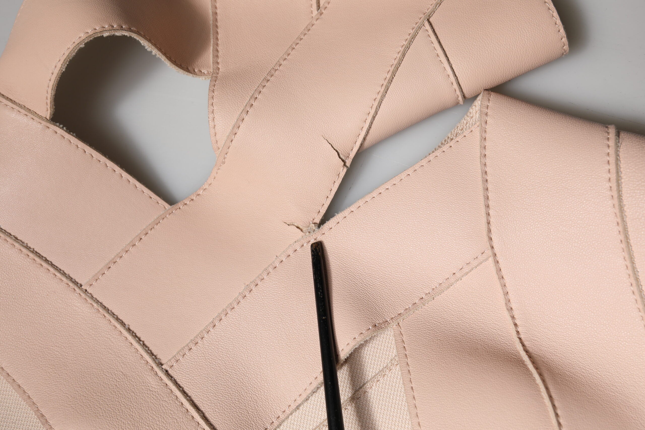 Indulge in the exquisite allure of the Dsquared² Beige Leather Short Sleeves Sheath Mini Dress, a masterpiece of Italian craftsmanship that embodies timeless elegance and sophistication.