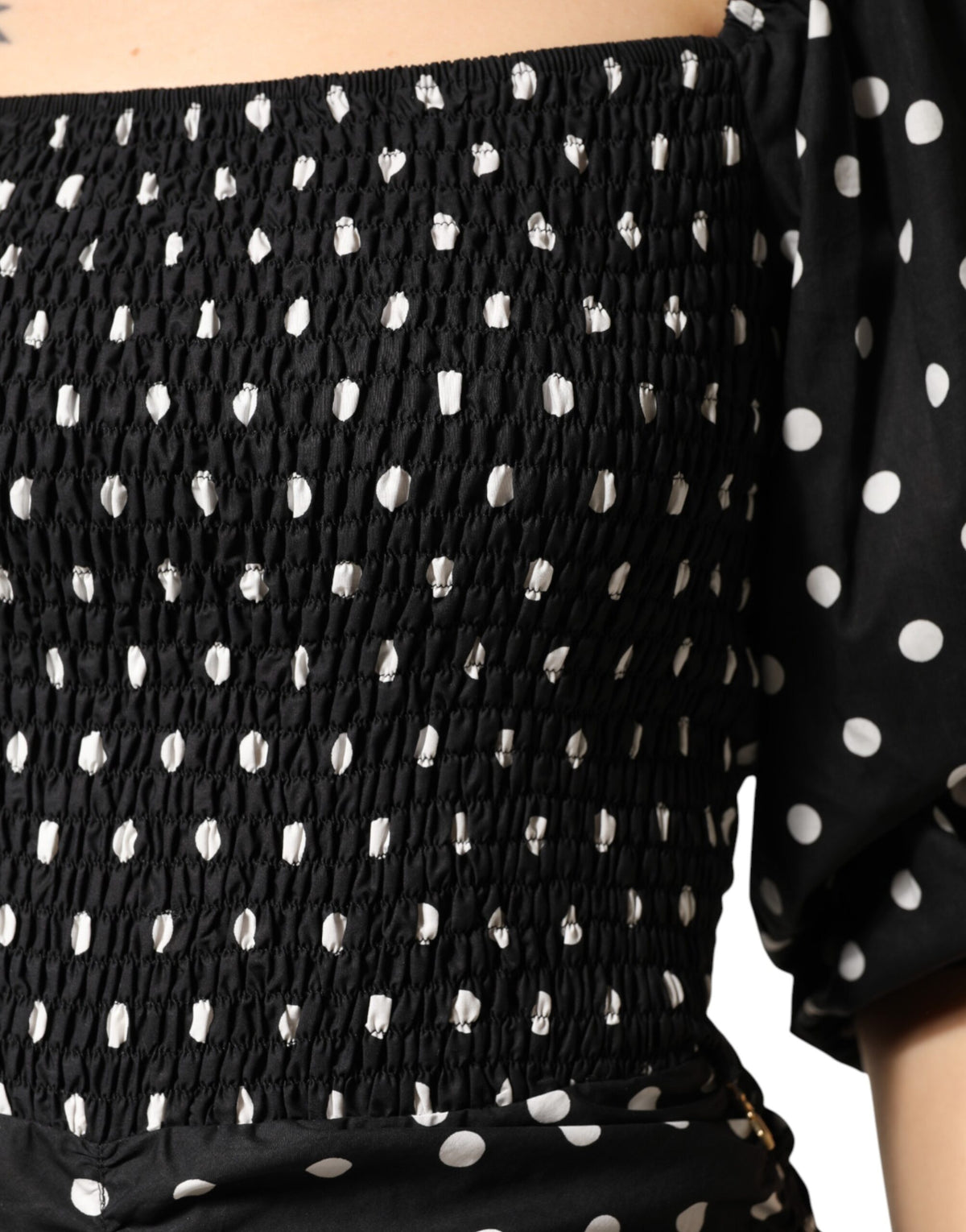 Elevate your wardrobe with the Patrizia Pepe black and white polka dot mini dress, a timeless blend of sophistication and sensuality, perfect for any occasion.
