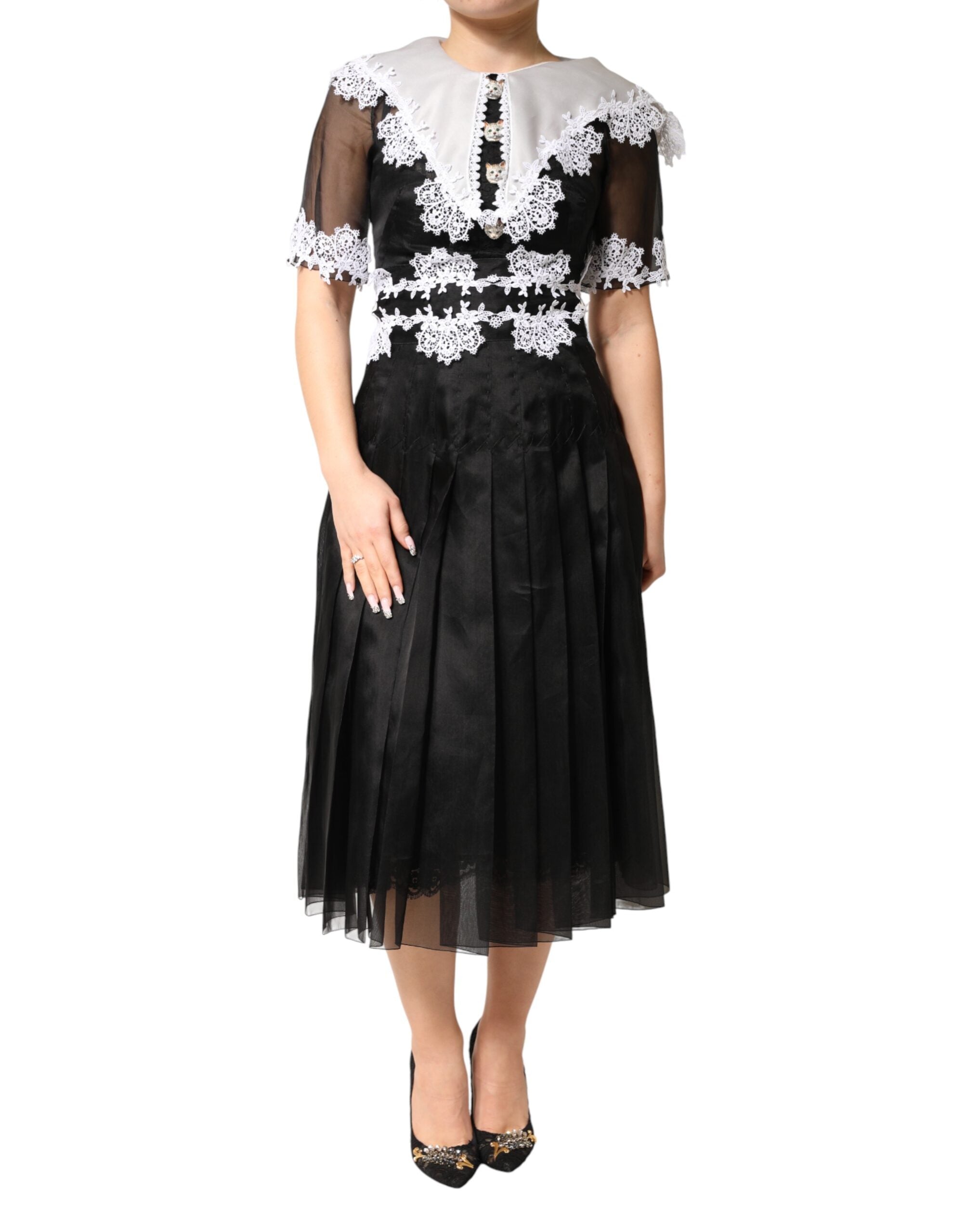 Discover the Dolce & Gabbana Black White Silk Macrame Lace Midi Dress, a masterpiece of Italian craftsmanship that embodies timeless elegance and refined allure.