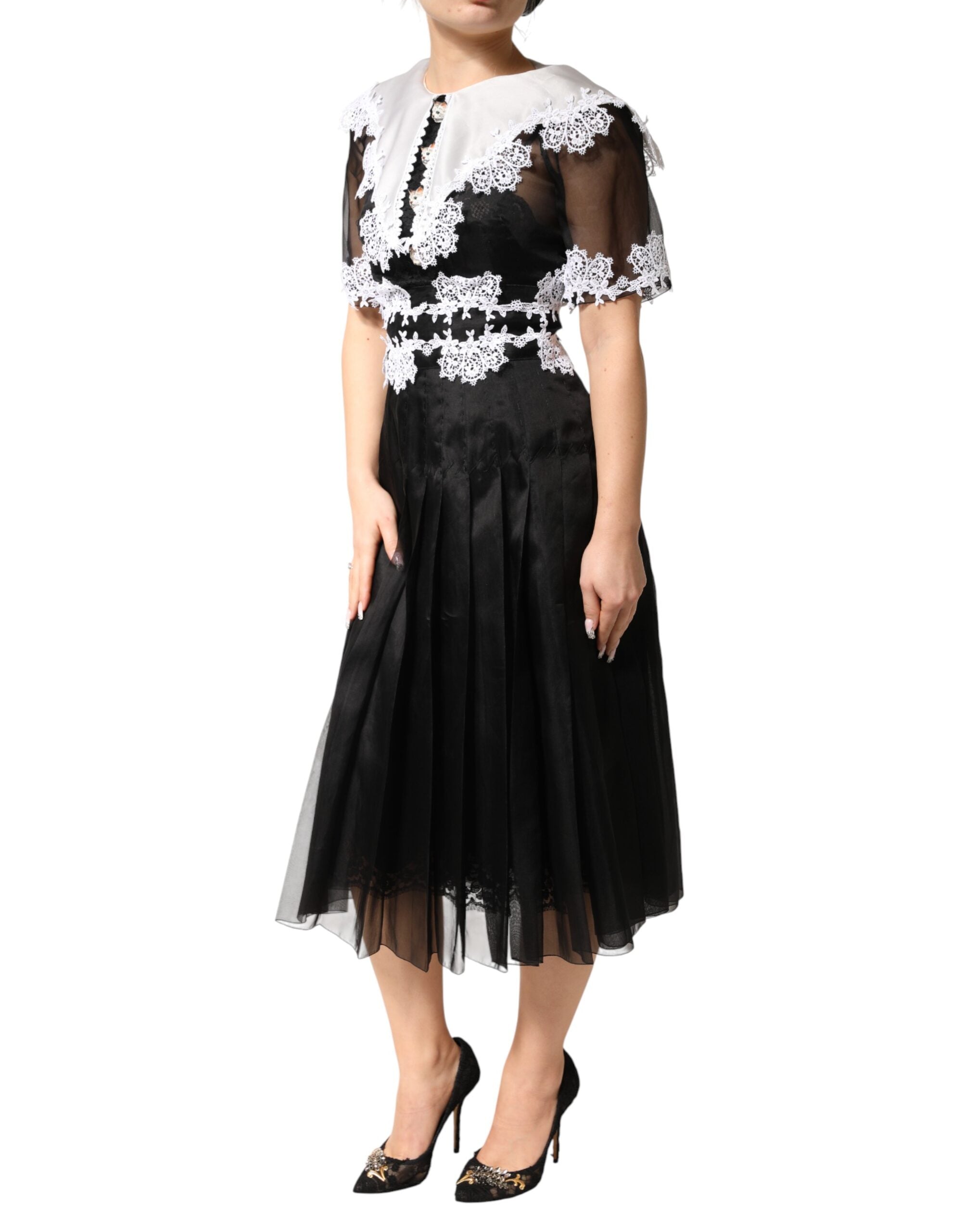 Experience the exquisite allure of the Dolce & Gabbana Black White Silk Macrame Lace Midi Dress, where luxurious silk meets unparalleled Italian craftsmanship for timeless elegance.