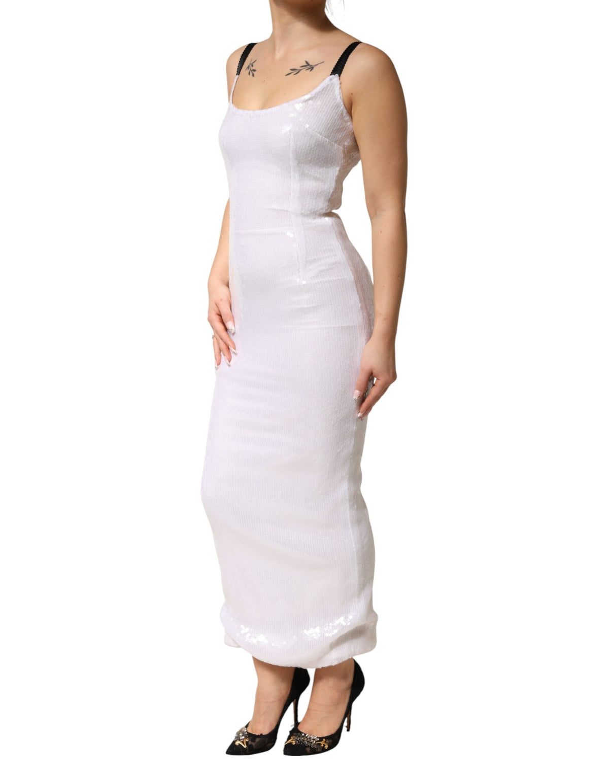 Elevate your wardrobe with the Dolce & Gabbana White Polyester Sleeveless Sheath Dress, a masterpiece of Italian craftsmanship that embodies timeless elegance and sophistication.