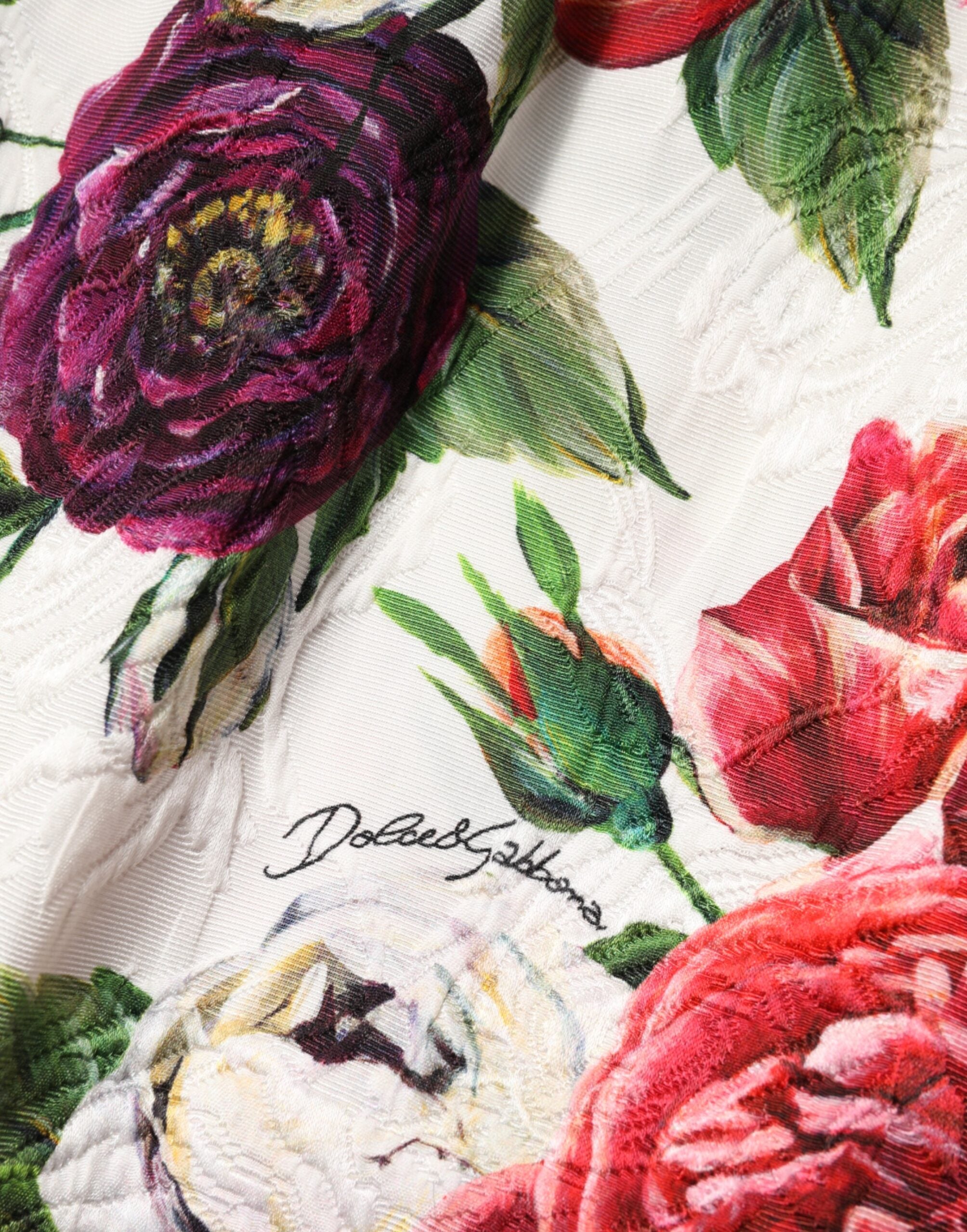Elevate your elegance with the Dolce & Gabbana White Floral Embellished Sheath Mini Dress, a masterpiece of Italian craftsmanship and luxurious materials, perfect for the discerning fashion aficionado.