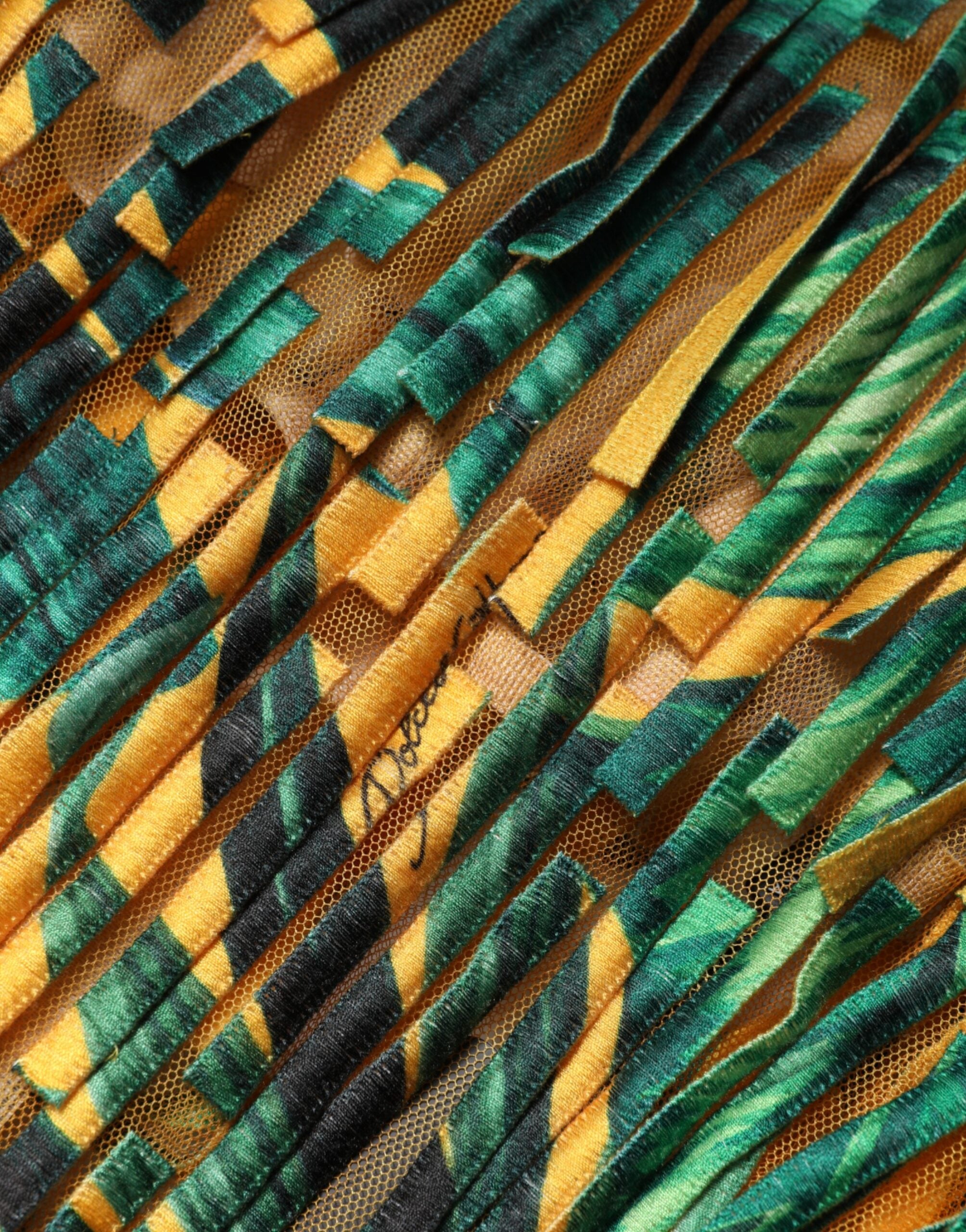 Indulge in the exquisite Dolce & Gabbana Multicolor Tropical Print Fringe Maxi Dress, a luxurious blend of cotton and polyester, handcrafted in Italy for effortless elegance and timeless allure.