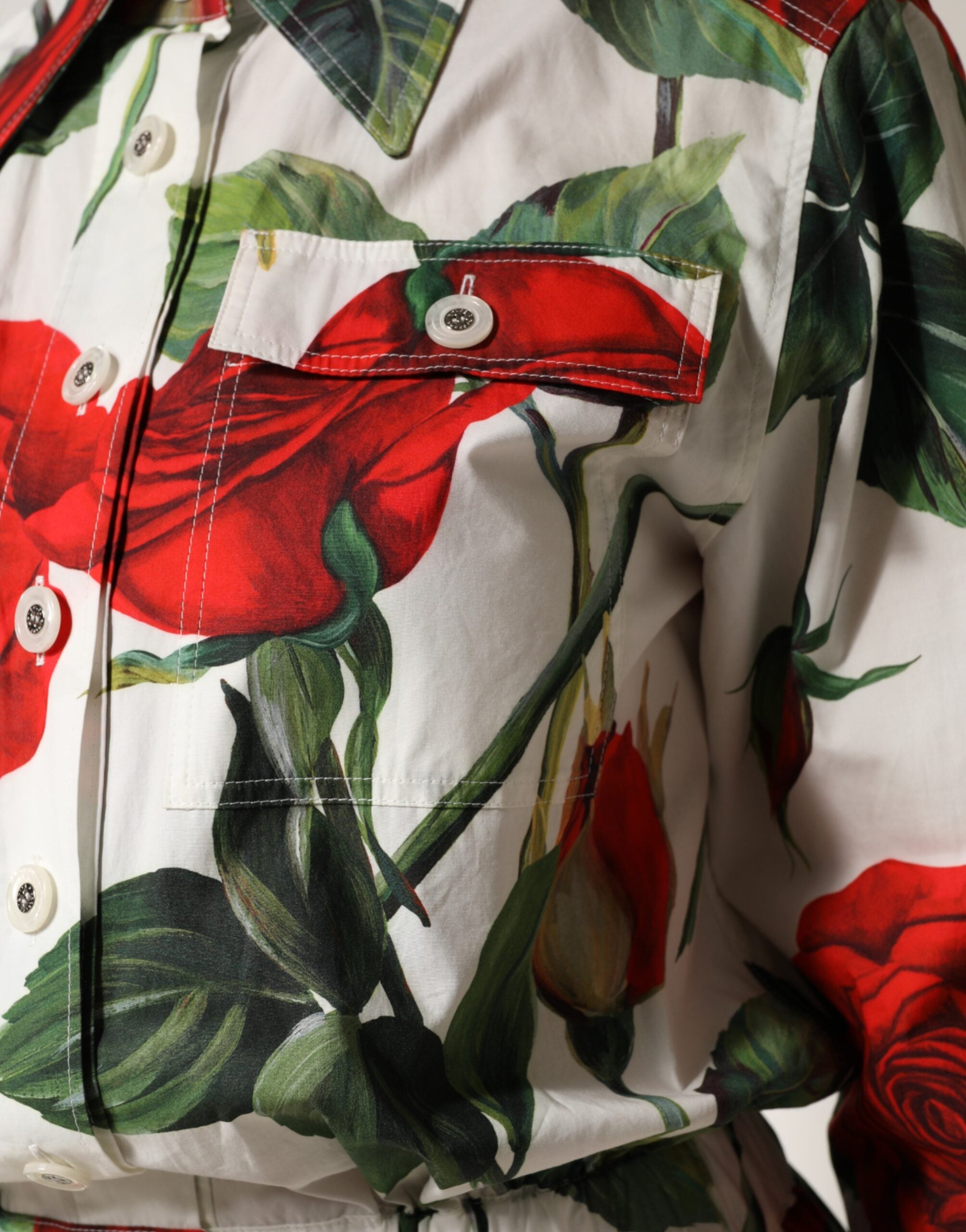 Elevate your wardrobe with the Dolce & Gabbana White Floral Print Cotton Jumpsuit Dress, a masterpiece of exquisite craftsmanship and timeless elegance, perfect for any occasion.