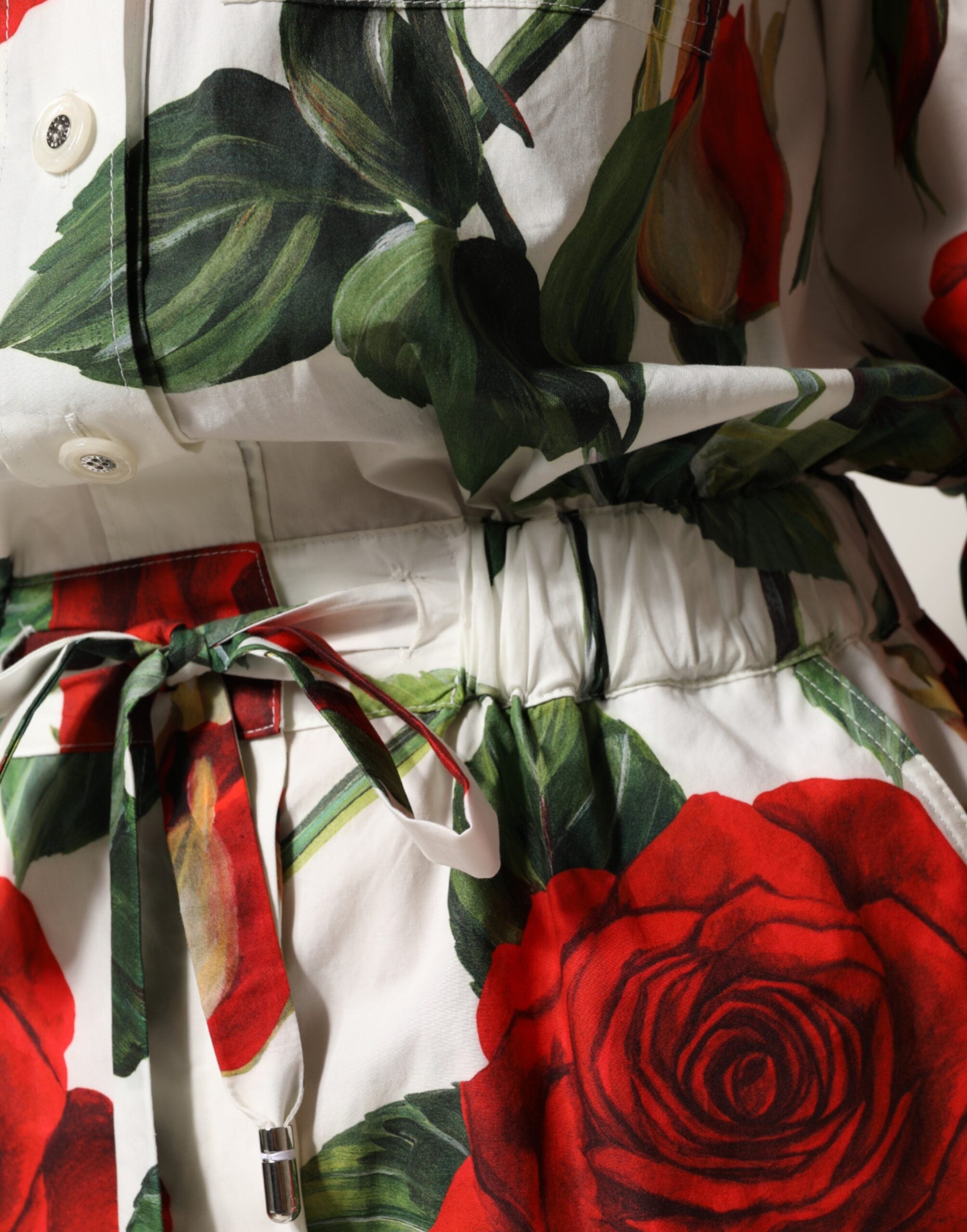 Elevate your wardrobe with the Dolce & Gabbana White Floral Print Cotton Jumpsuit Dress, a masterpiece of Italian craftsmanship that embodies timeless elegance and allure.