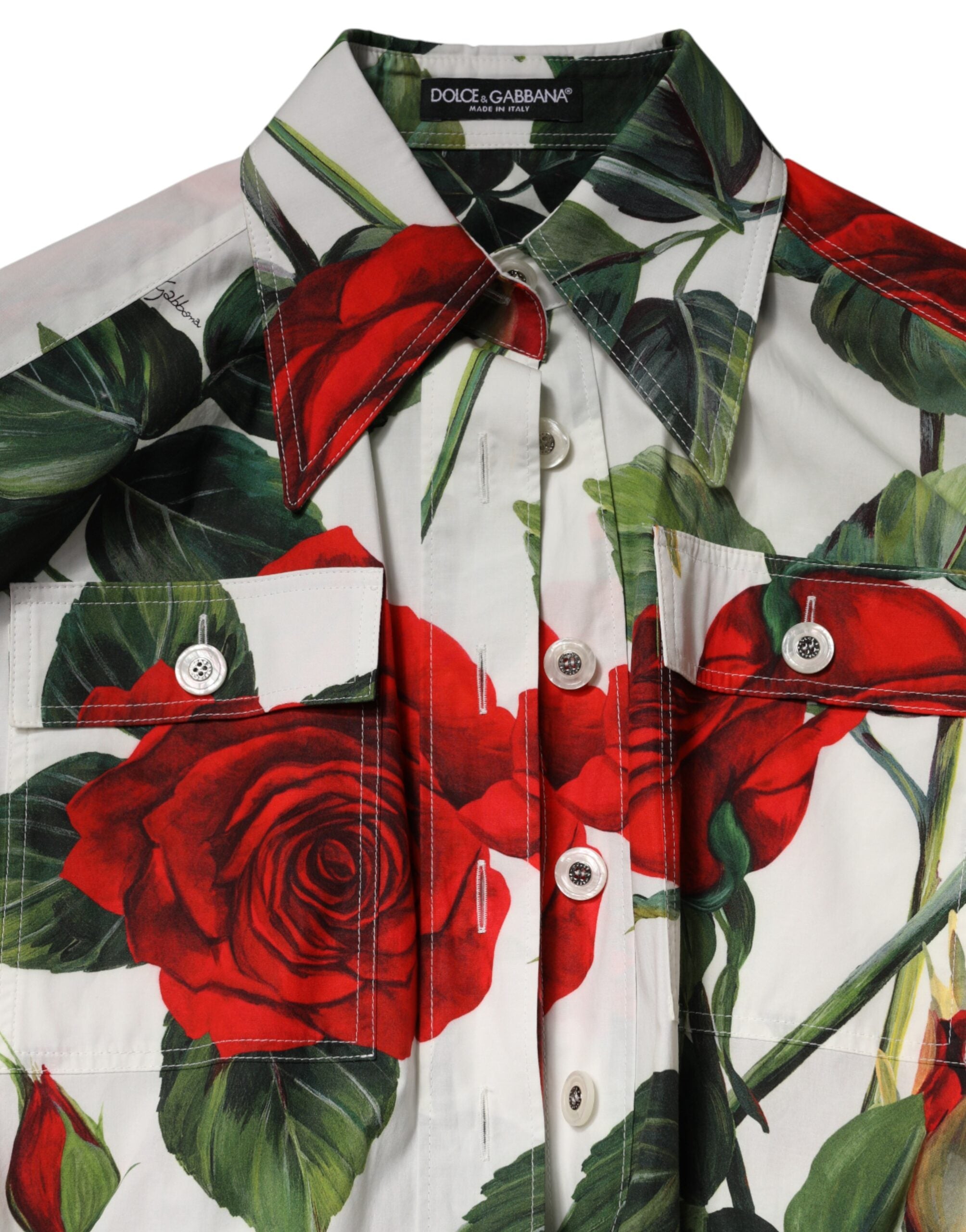 Elevate your wardrobe with the Dolce & Gabbana White Floral Print Cotton Jumpsuit Dress, a masterpiece of exquisite craftsmanship and timeless elegance, perfect for the discerning individual.