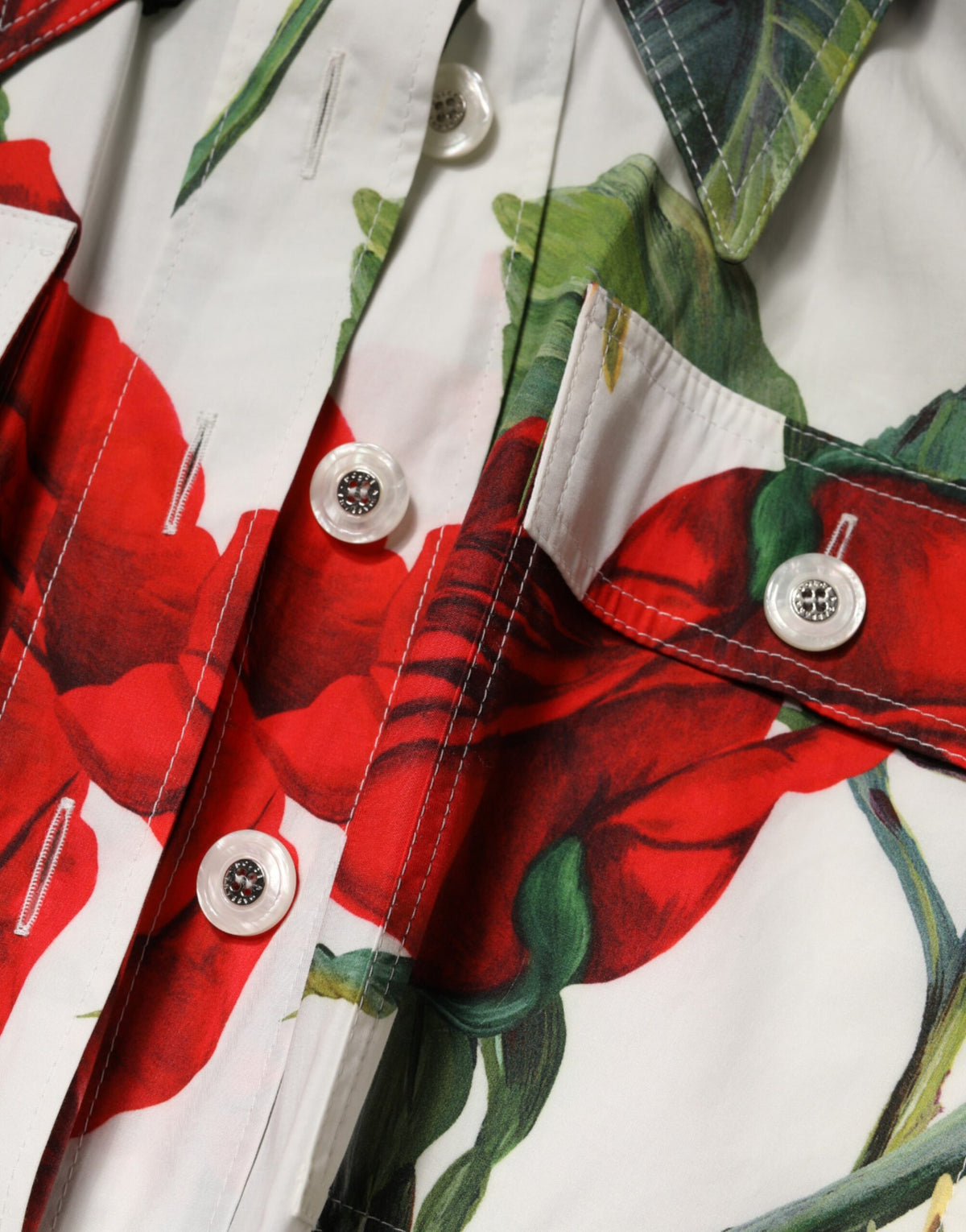 Elevate your wardrobe with the Dolce & Gabbana White Floral Print Cotton Jumpsuit Dress, a masterpiece of Italian craftsmanship that embodies timeless elegance and sensual allure.