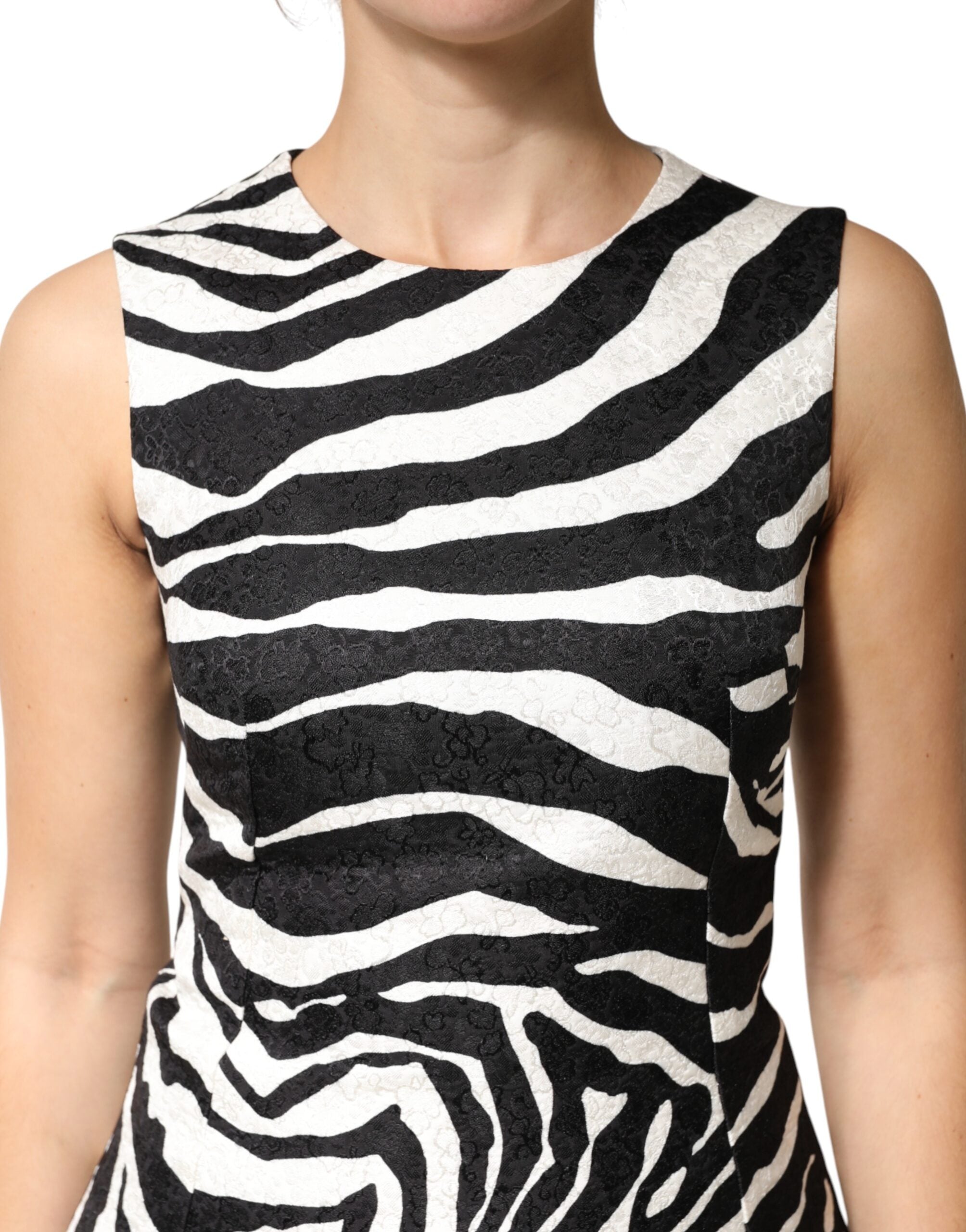 Experience the allure of Dolce & Gabbana's Black White Zebra Sleeveless A-line Dress, crafted from a luxurious cotton-viscose blend, perfect for those who embody elegance and confidence.