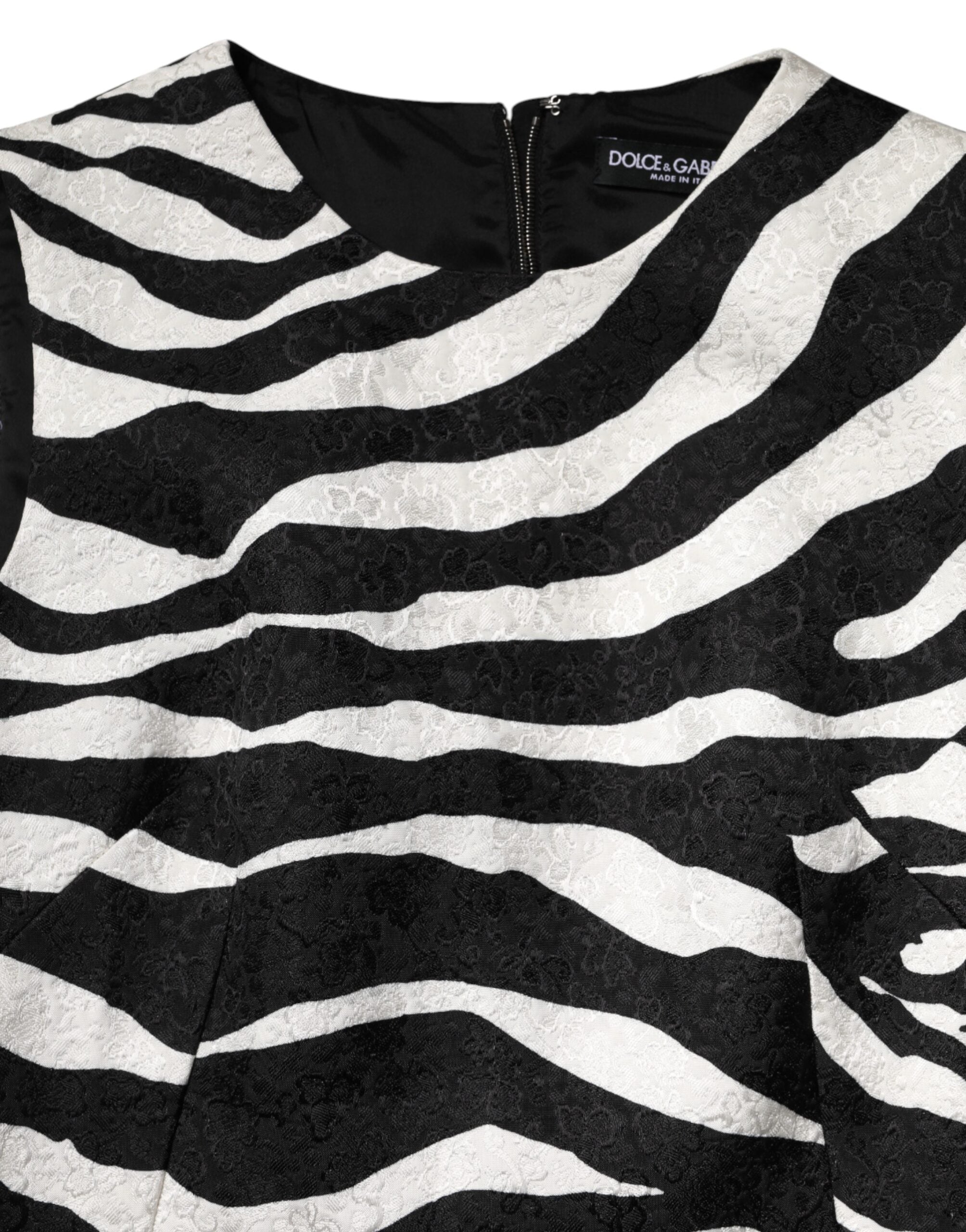 Indulge in the exquisite Dolce & Gabbana Black White Zebra Sleeveless A-line Dress, a masterpiece of luxurious cotton-viscose blend, perfect for the discerning individual who embodies elegance and confidence.