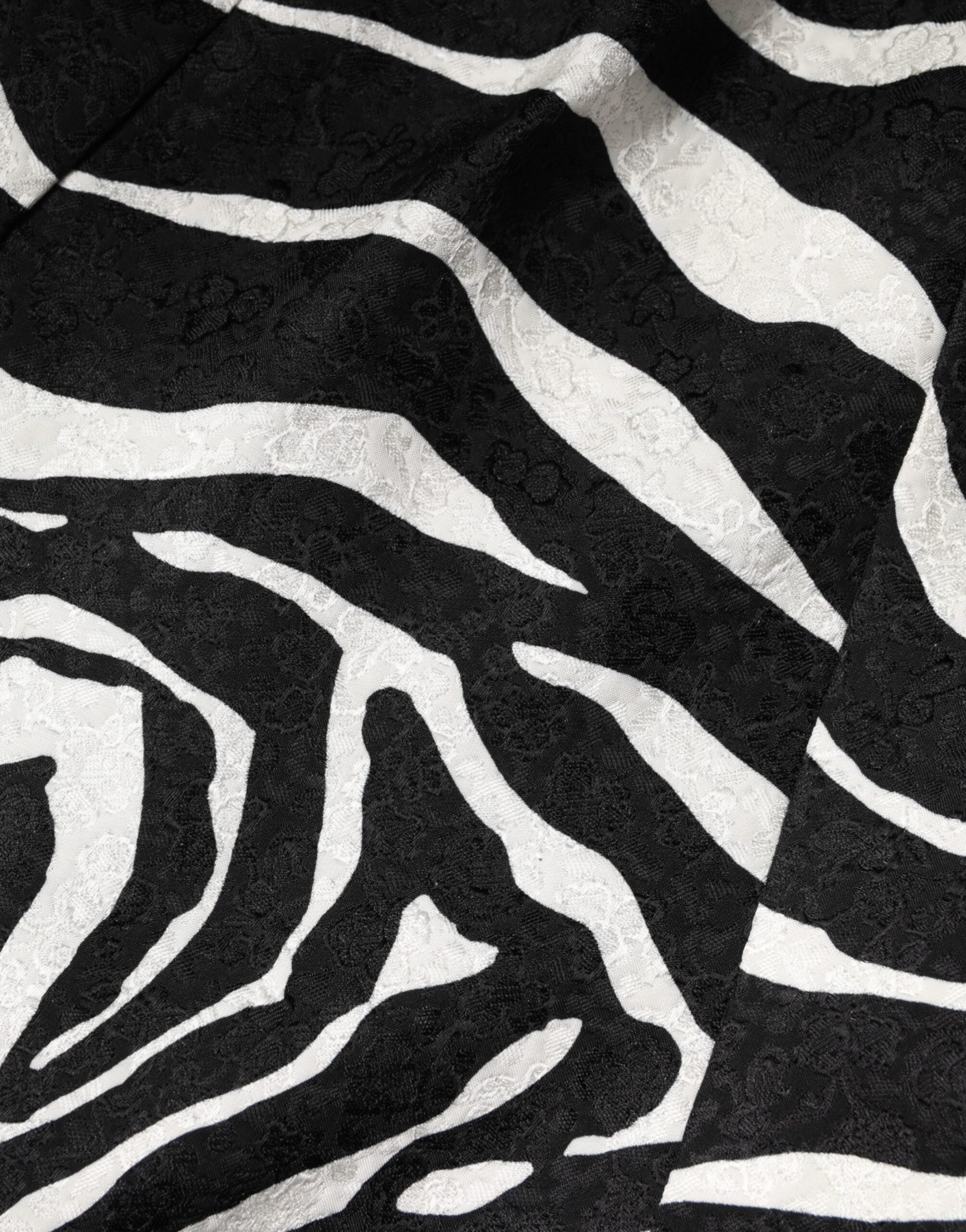 Discover the Dolce & Gabbana Black White Zebra Sleeveless A-line Dress, a luxurious blend of cotton and viscose, embodying exquisite craftsmanship and timeless elegance for the discerning individual.