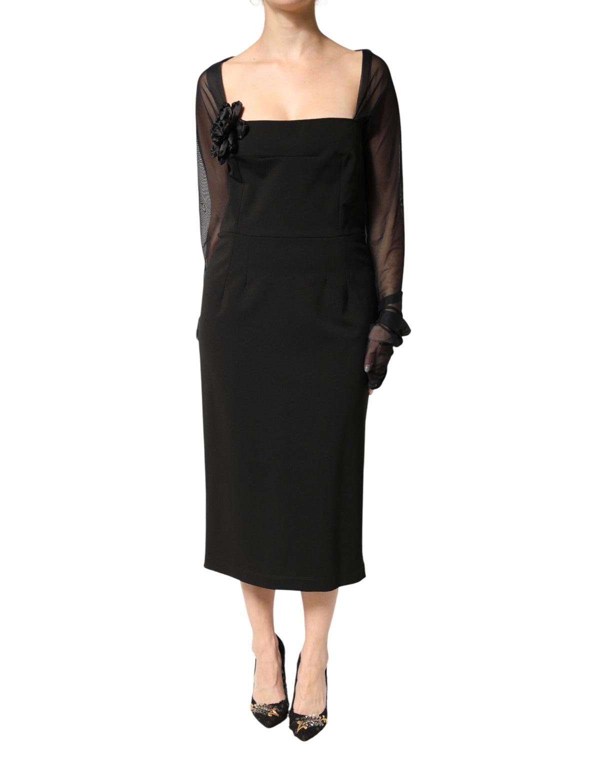 Experience the exquisite allure of the Dolce & Gabbana Black Sheer Yoke Rosette Midi Dress, a luxurious embodiment of Italian craftsmanship and timeless elegance.