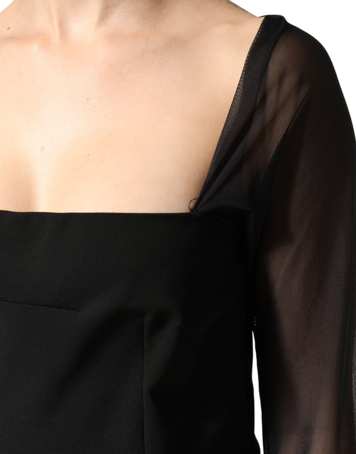 Experience the exquisite allure of the Dolce & Gabbana Black Sheer Yoke Rosette Midi Dress, a masterpiece of Italian craftsmanship that embodies luxury and confident elegance.