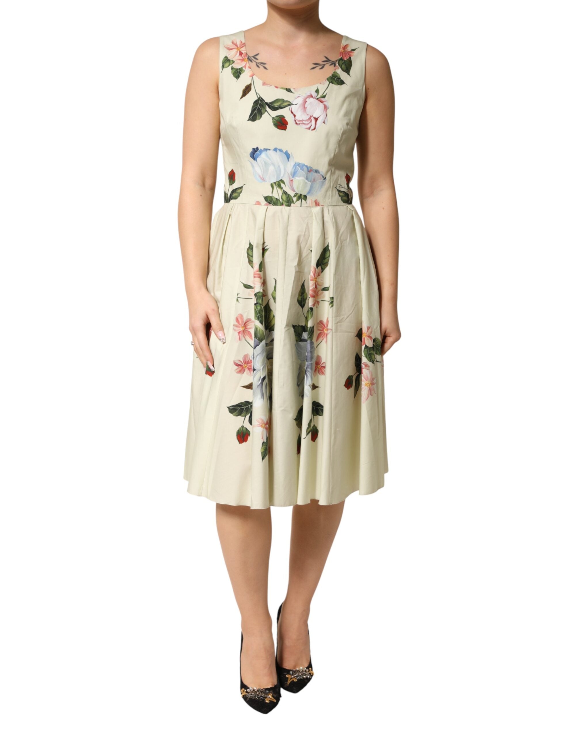 Indulge in the exquisite craftsmanship of the Dolce & Gabbana Beige Floral Sleeveless A-line Dress, a timeless piece that embodies luxury and sensual elegance for the discerning individual.