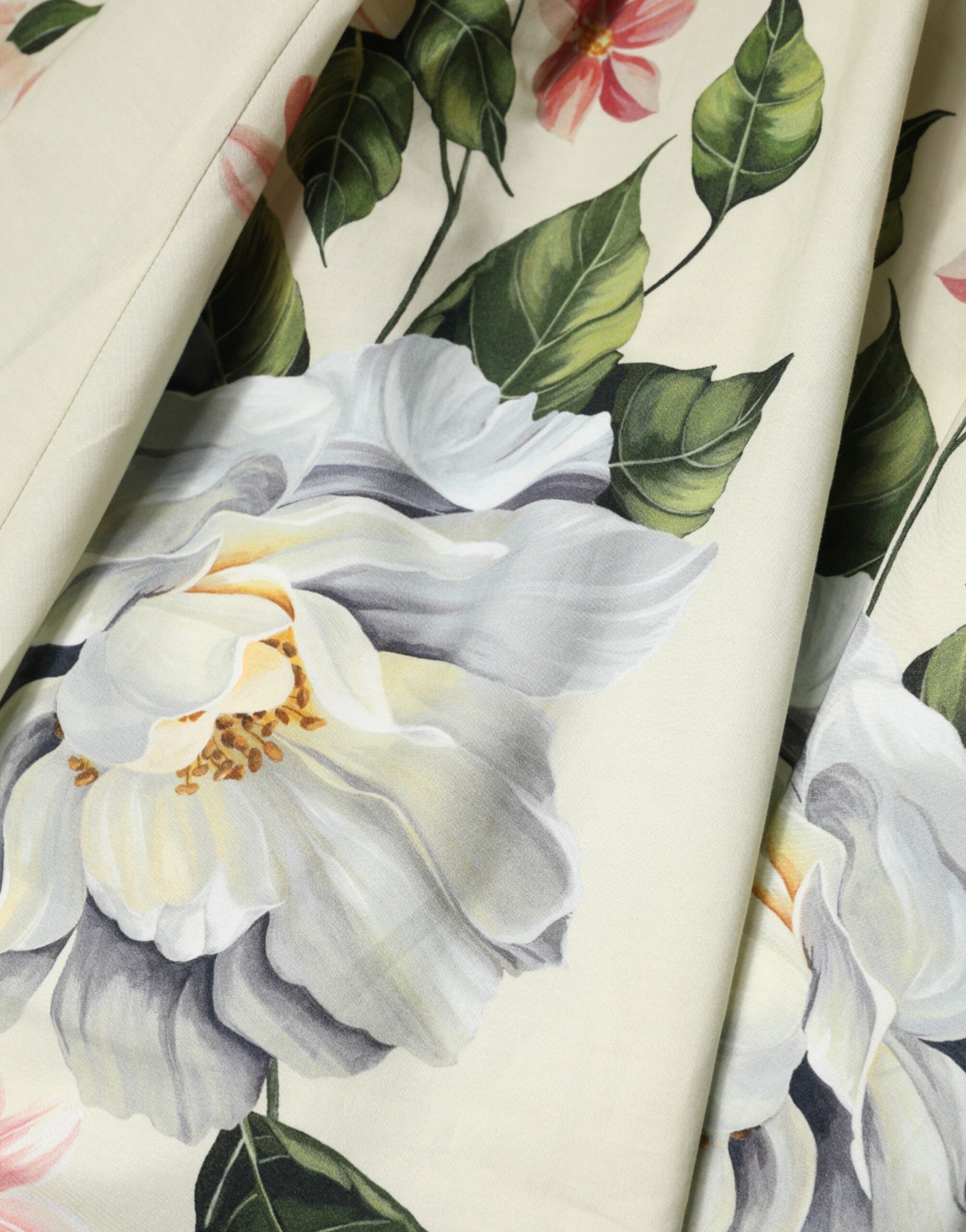 Indulge in the exquisite Dolce & Gabbana Beige Floral Sleeveless A-line Dress, a masterpiece of 100% cotton craftsmanship that embodies refined luxury and timeless elegance.