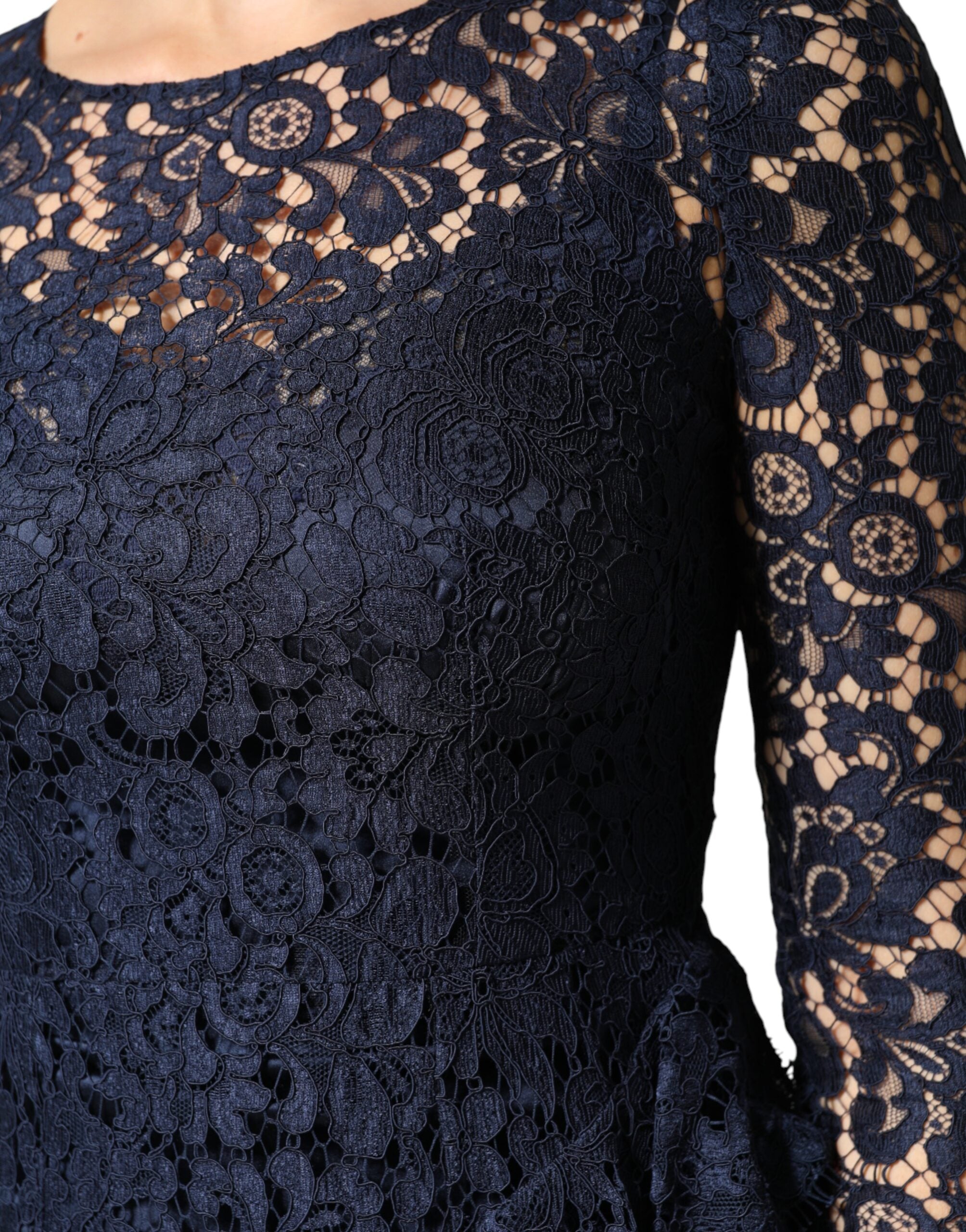 Experience the exquisite allure of the Dolce & Gabbana Blue Lace Ruffle A-line Knee Length Dress, a timeless masterpiece crafted from luxurious materials, perfect for the discerning individual who embodies elegance and sophistication.