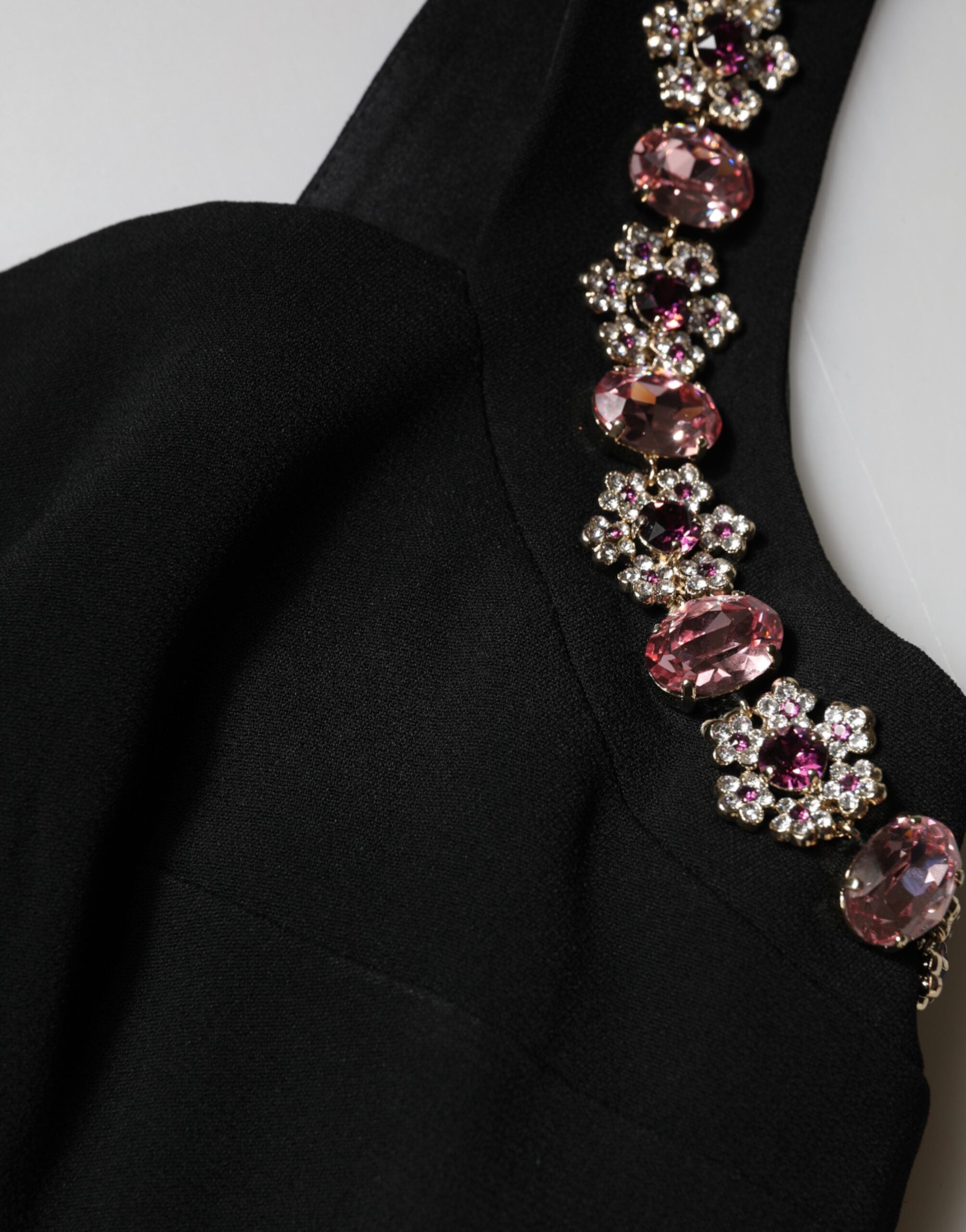 Discover the Dolce & Gabbana Black Embellished Bodycon Long Gown, a masterpiece of exquisite craftsmanship, merging luxurious fabrics with alluring details for an unforgettable presence.