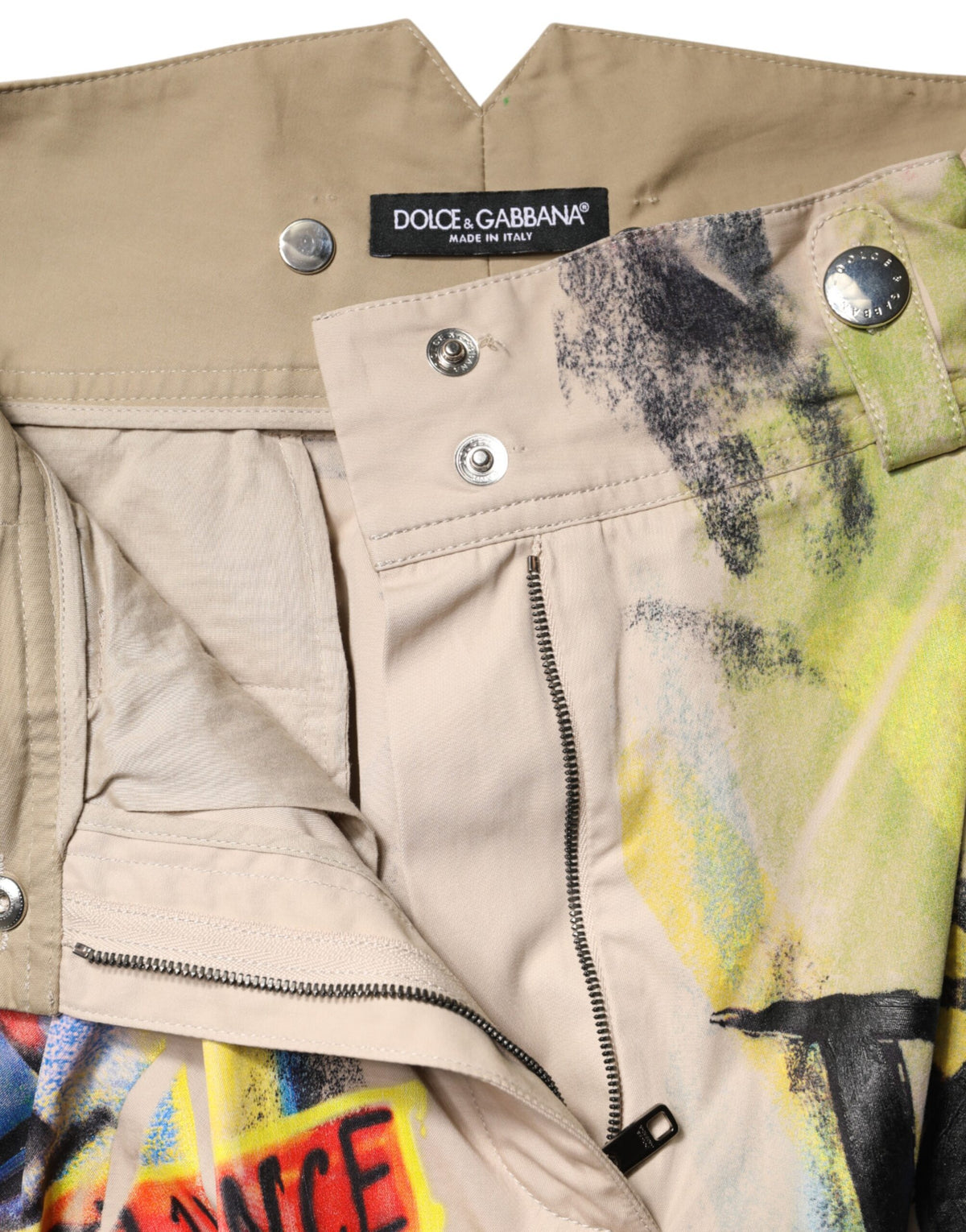 Elevate your summer wardrobe with Dolce & Gabbana's Multicolor Graffiti High-Waist Bermuda Shorts, crafted from luxurious cotton, embodying urban artistry and sophistication.