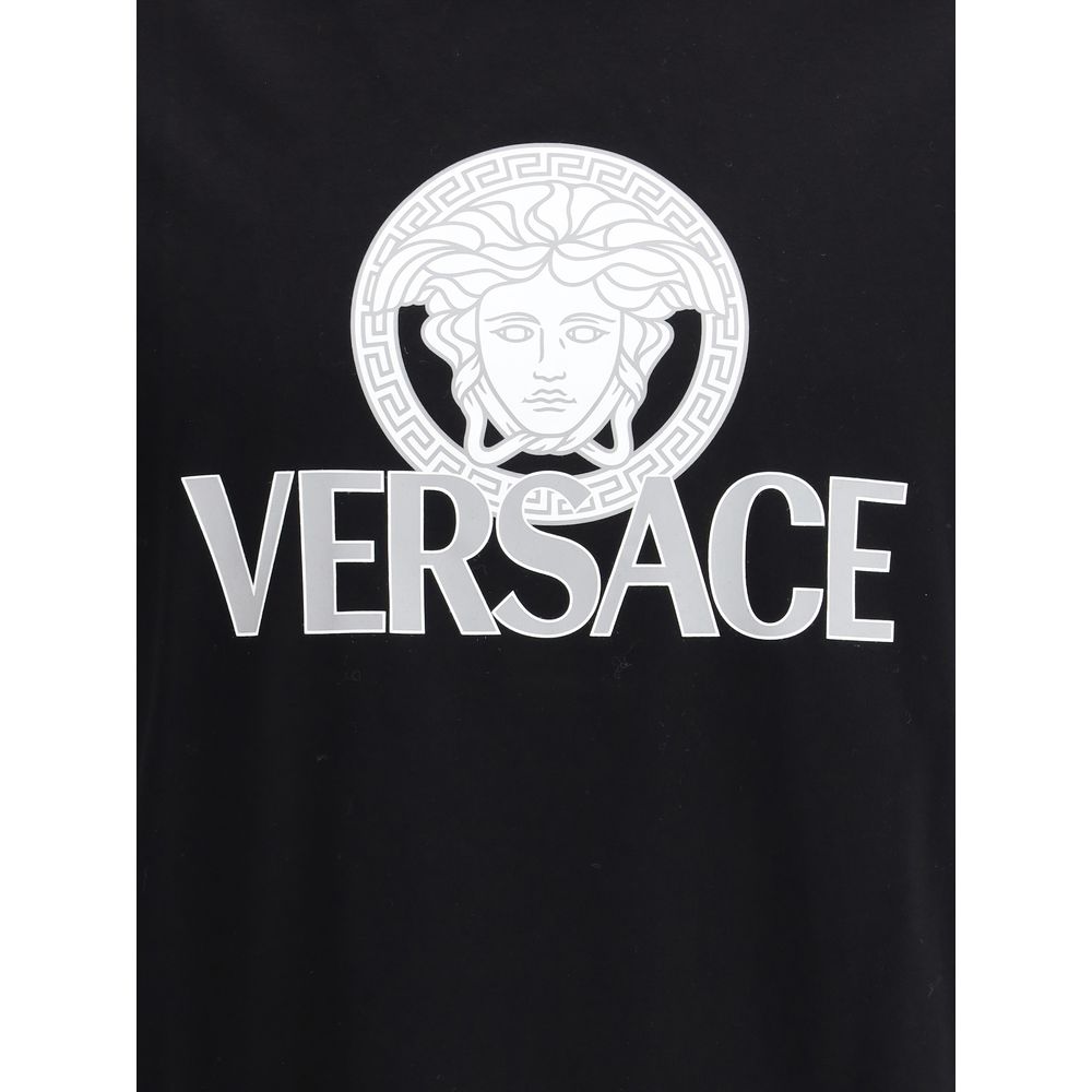 Indulge in the Versace Black Cotton T-Shirt, a luxurious staple crafted from premium cotton, merging elegance and modern style for the discerning individual.