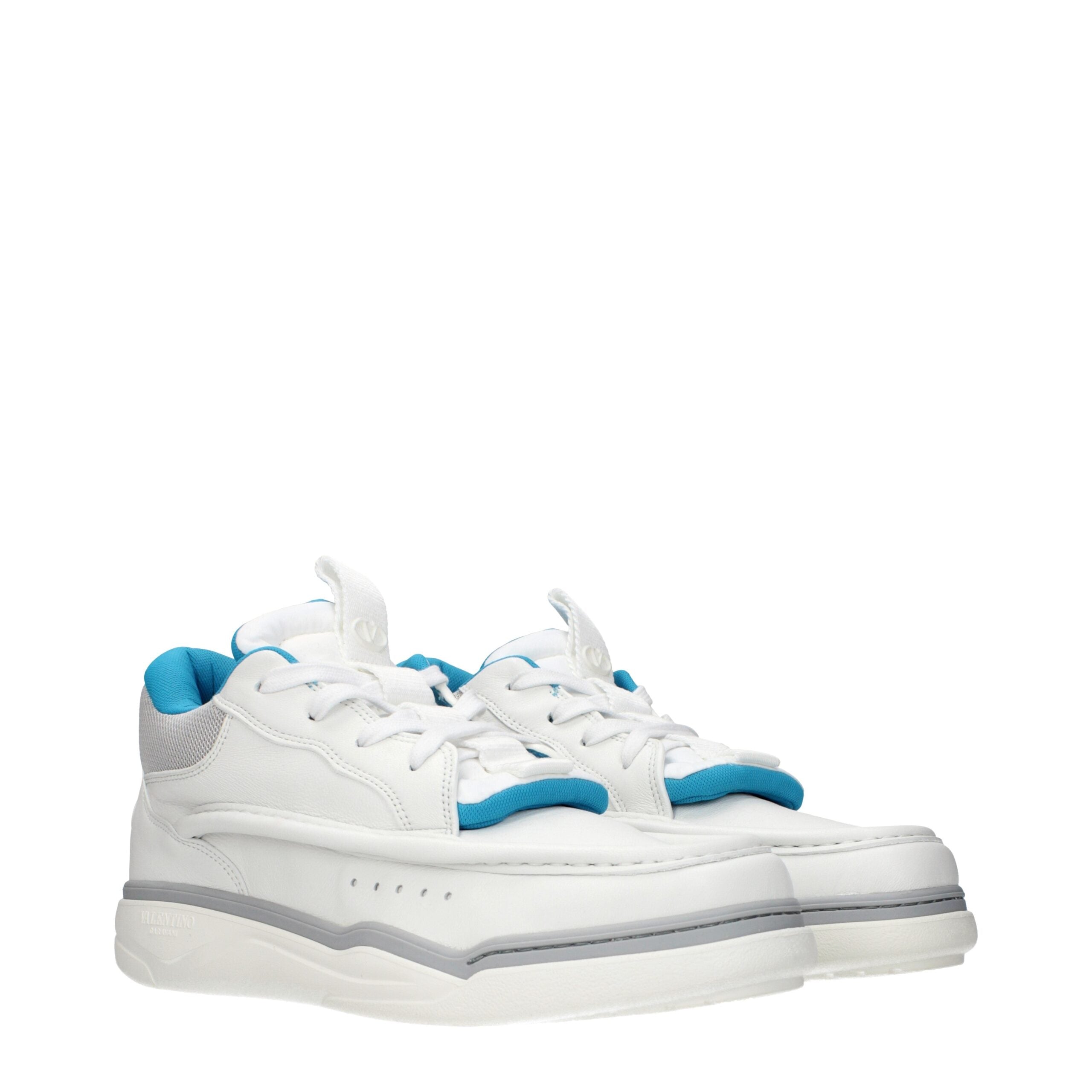Indulge in the exquisite craftsmanship of Valentino Garavani White Leather Low Top Sneakers, where refined elegance meets modern sophistication for the discerning fashion connoisseur.