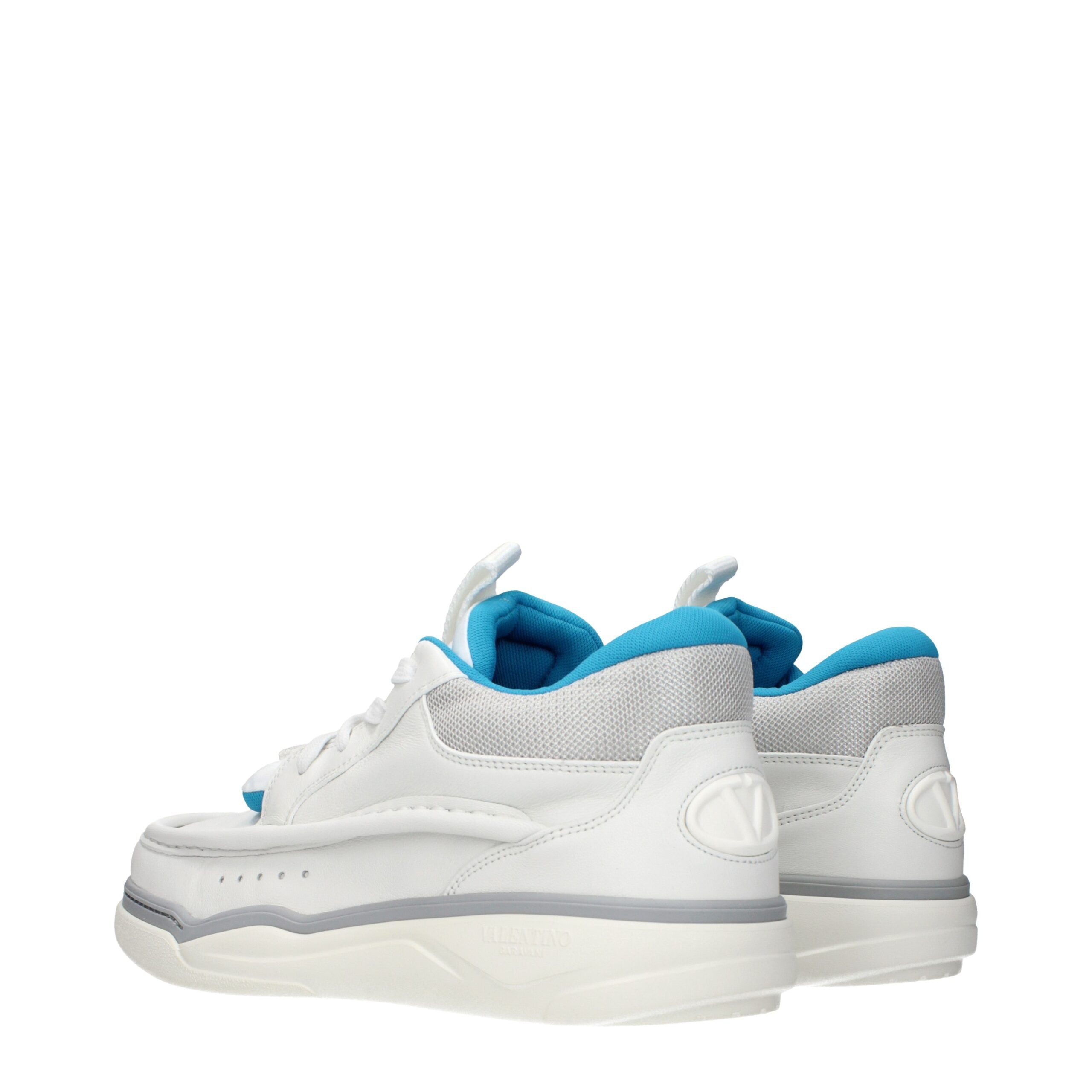 Indulge in the exquisite craftsmanship of Valentino Garavani White Leather Low Top Sneakers, where refined elegance meets modern sophistication for discerning tastes.