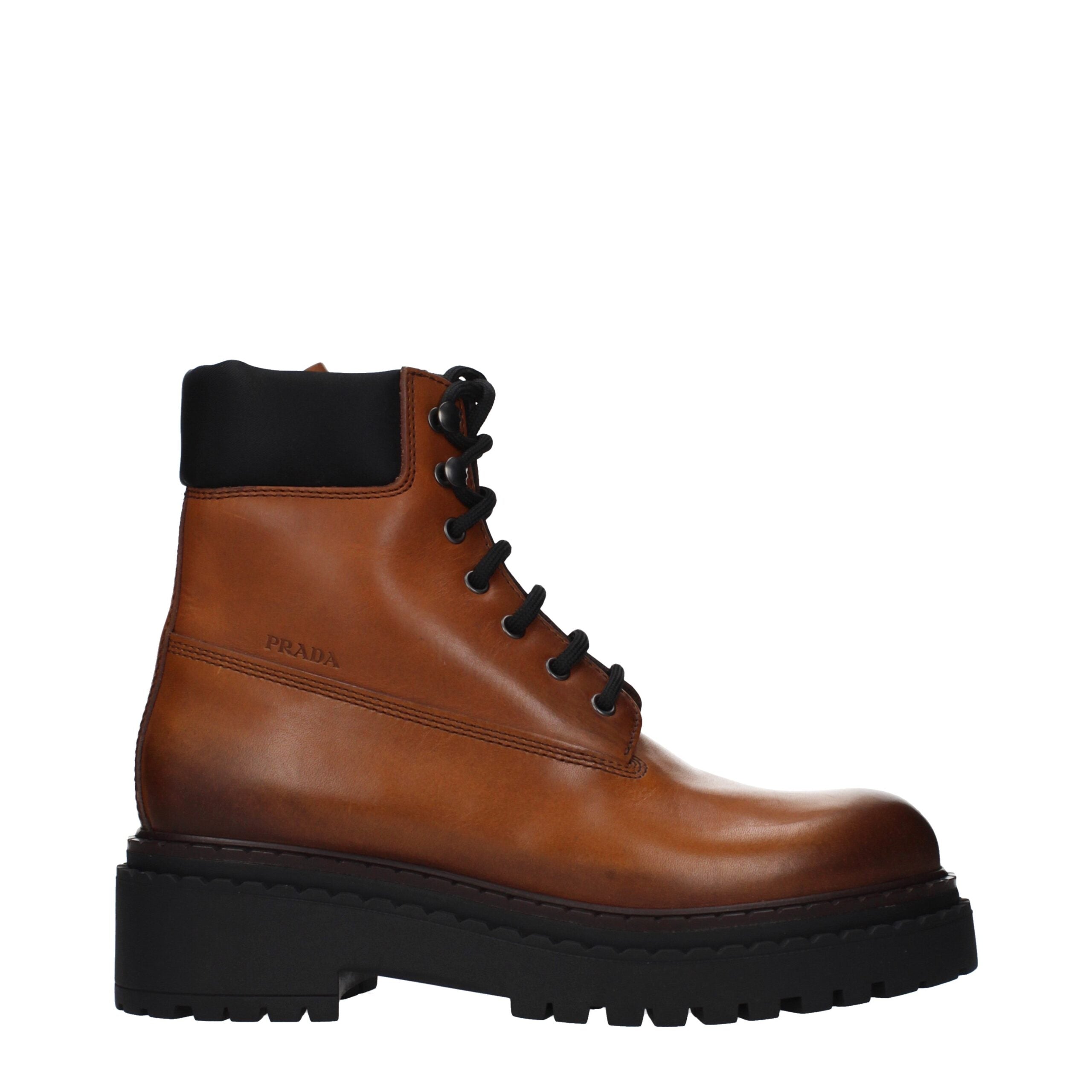 Step into luxury with Prada Brown Leather Ankle Boots, where exquisite craftsmanship meets timeless elegance, perfect for the discerning individual seeking sophistication.