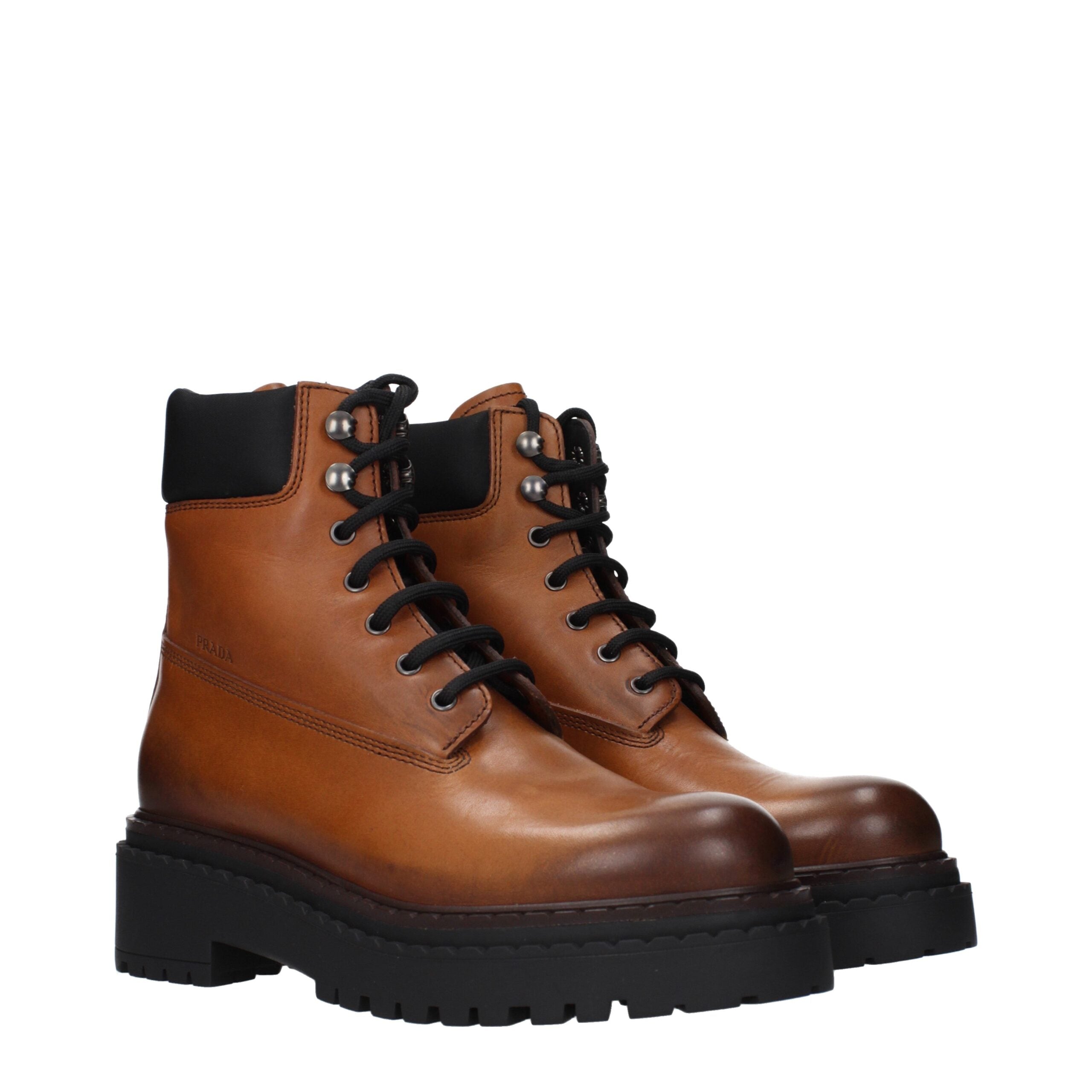 Step into the realm of luxury with Prada Brown Leather Ankle Boots, where exquisite craftsmanship meets timeless elegance, perfect for the discerning individual.