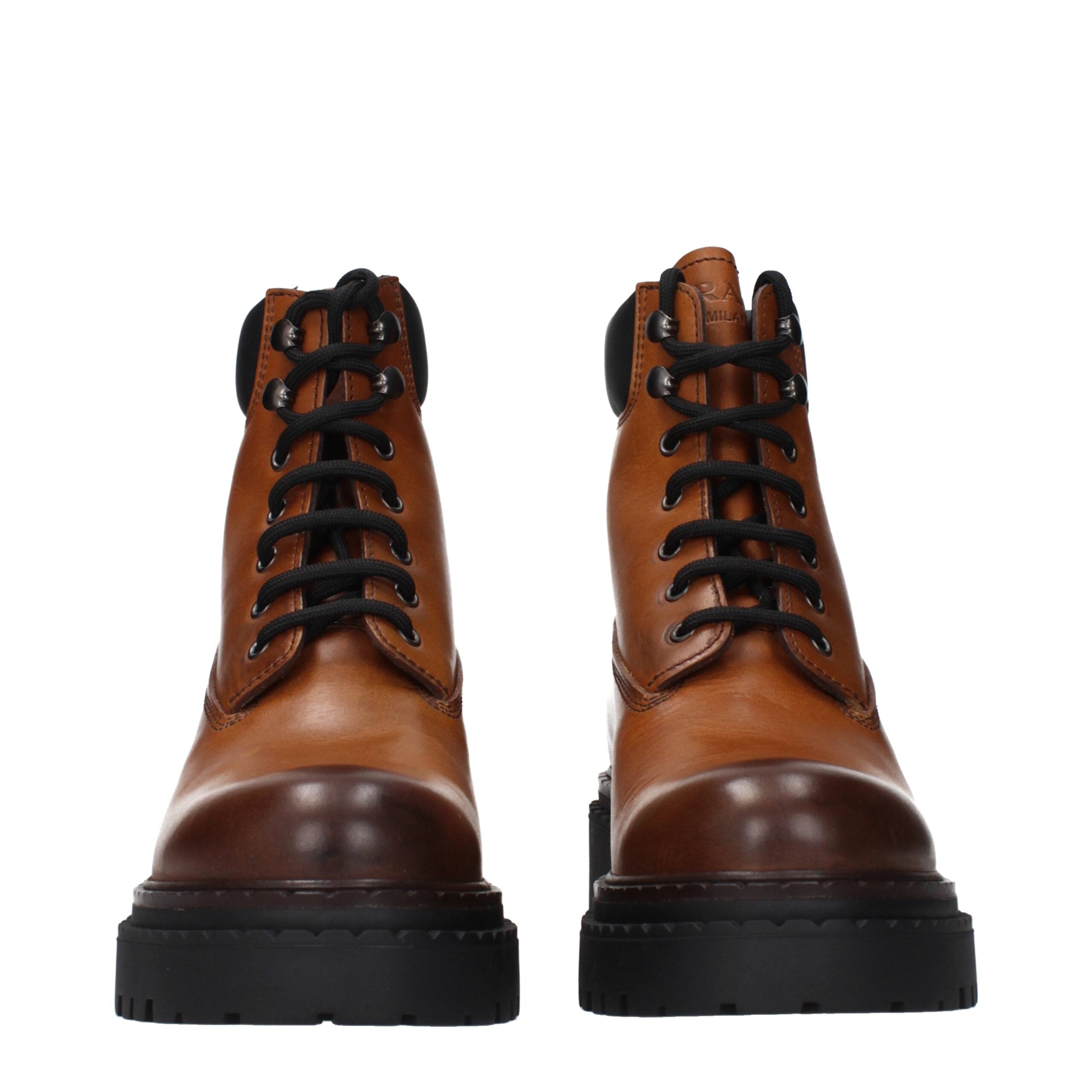 Step into refined elegance with Prada Brown Leather Ankle Boots, where exquisite craftsmanship meets timeless allure, perfect for the discerning individual.