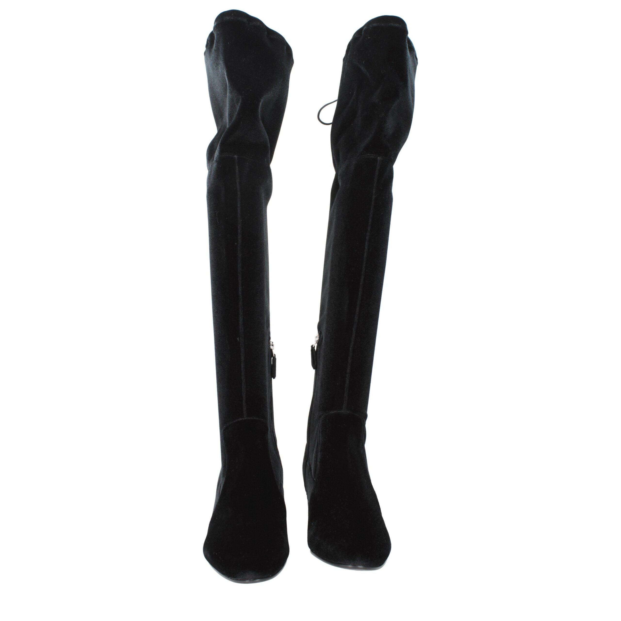 Indulge in the Prada Black Velvet Over The Knee Boots, where sumptuous velvet meets exquisite craftsmanship, elevating your style to new heights of luxury and allure.