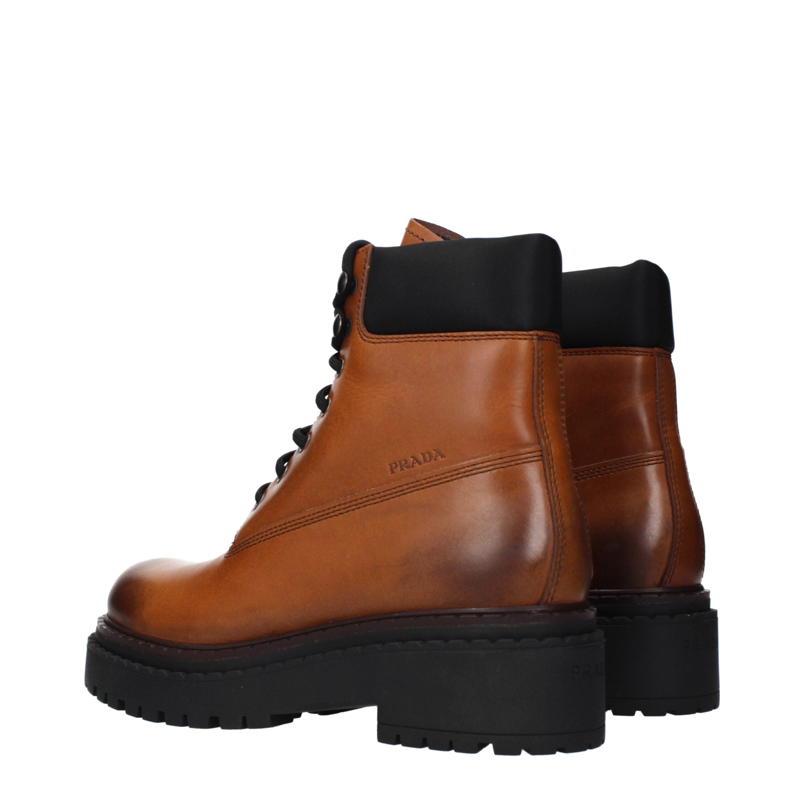 Step into the realm of luxury with Prada Brown Leather Ankle Boots, where exquisite craftsmanship and timeless elegance redefine your style narrative.