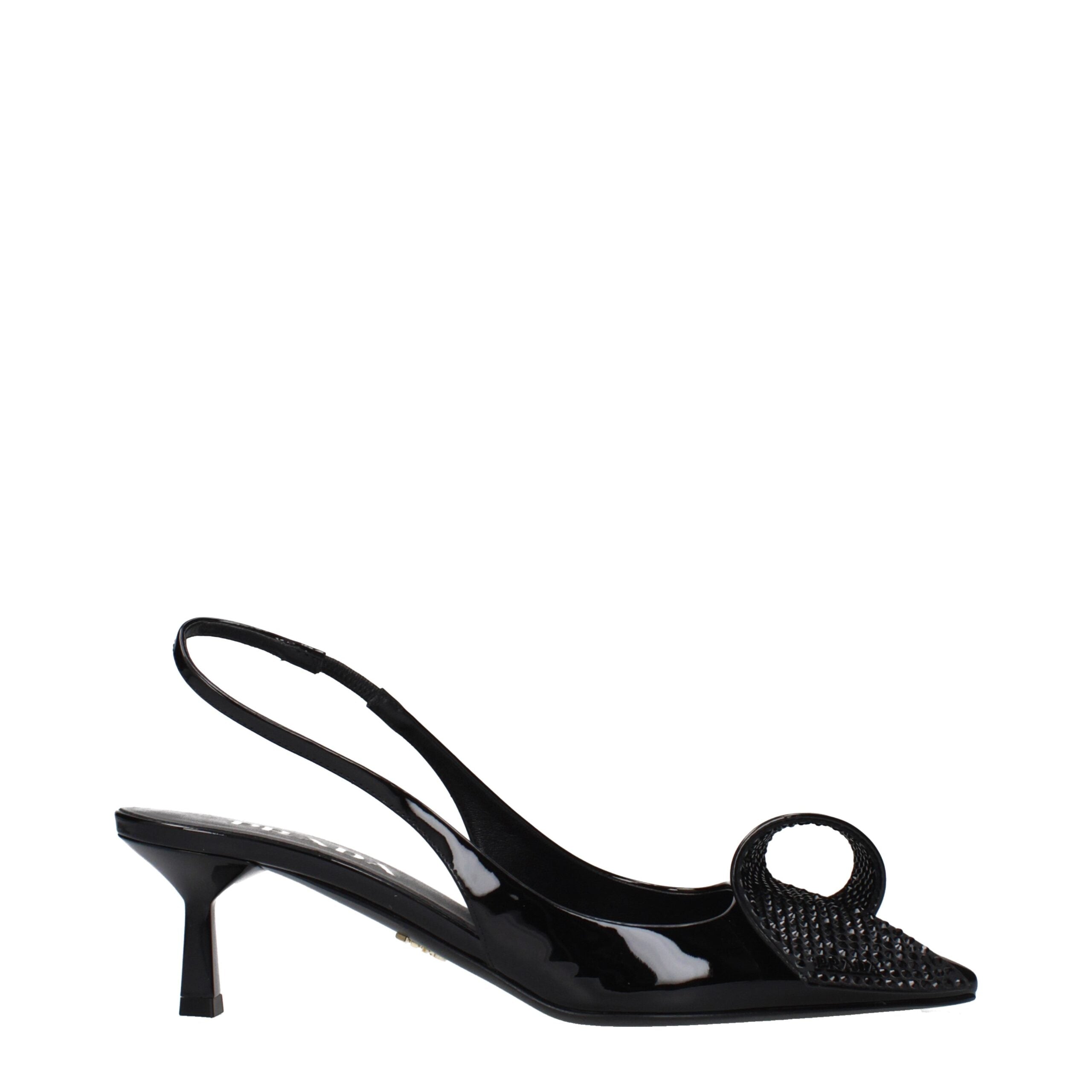 Indulge in the exquisite Prada Black Leather Stiletto Heel Sandals, where sumptuous patent leather meets timeless elegance, embodying sophistication for the discerning modern lover.