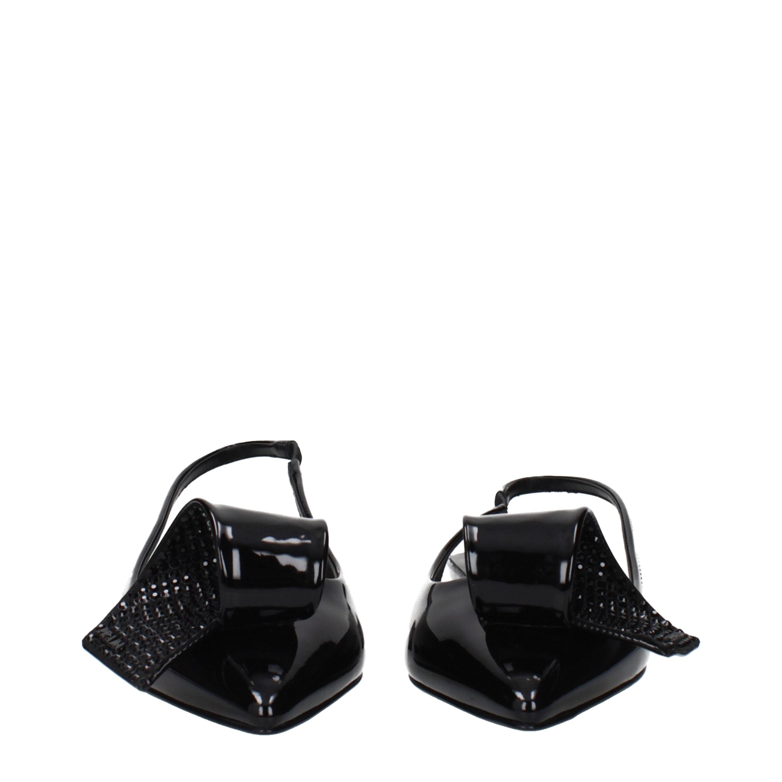 Experience unparalleled elegance with Prada Black Leather Flat Sandals, crafted from luxurious patent leather for the discerning individual who values sophistication and comfort.