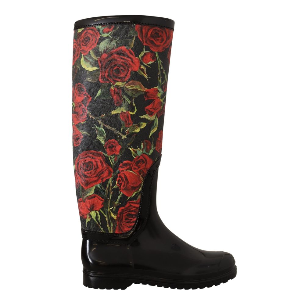 Indulge in the exquisite Dolce & Gabbana Black Polyvinyl Rain Boots, where luxurious craftsmanship meets a captivating red roses design, perfect for the discerning individual.