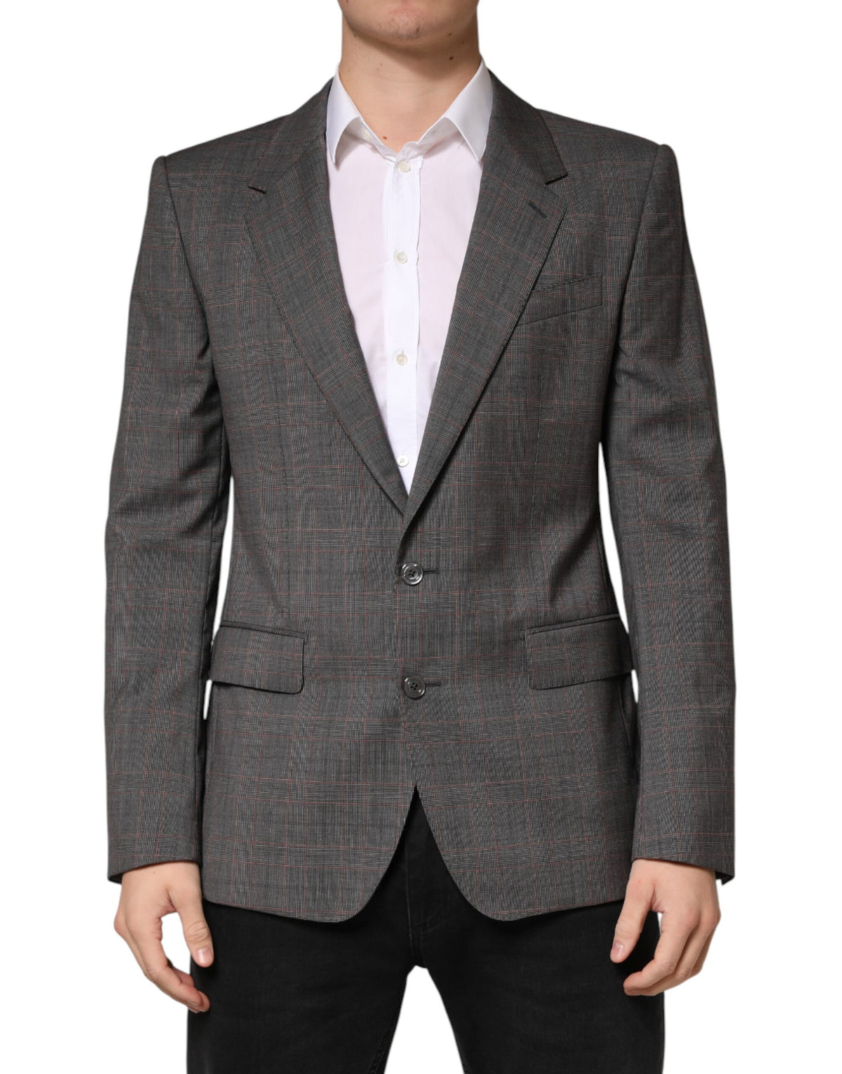 Discover the Dolce & Gabbana Gray Wool Blazer, a masterpiece of Italian craftsmanship, seamlessly blending luxury and sophistication for the discerning individual.