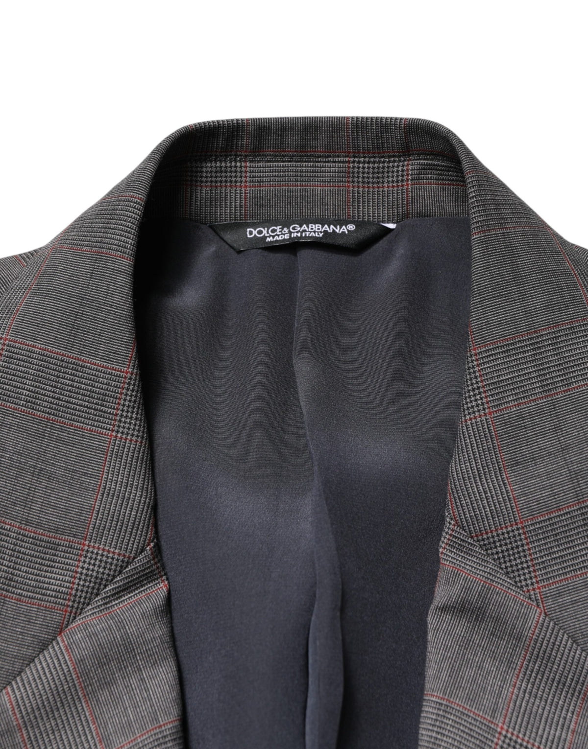 Elevate your wardrobe with the Dolce & Gabbana Gray Wool Blazer, crafted from luxurious virgin wool and silk lining, embodying timeless elegance and Italian craftsmanship.