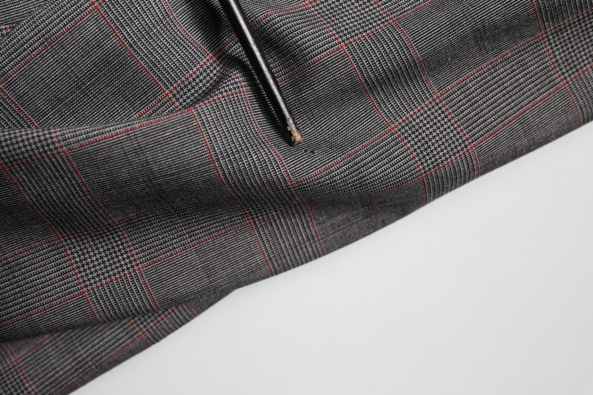Indulge in the exquisite allure of the Dolce & Gabbana Gray Wool Blazer, crafted from luxurious virgin wool and silk, embodying timeless elegance for the discerning individual.