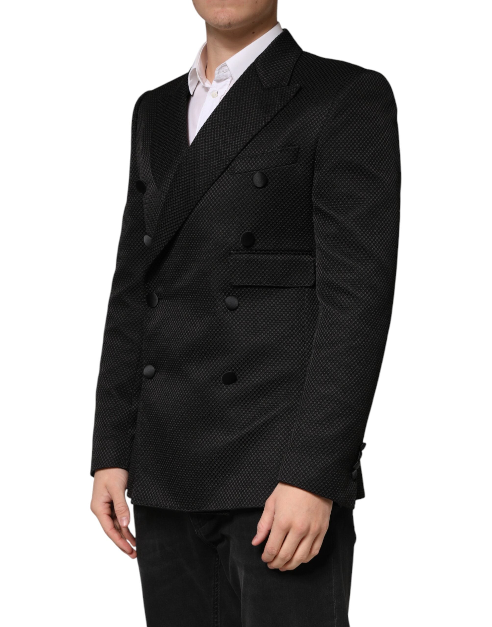 Elevate your wardrobe with the Dolce & Gabbana Black Cotton Double Breasted Blazer, a masterpiece of Italian craftsmanship, blending luxury and sophistication for the discerning individual.