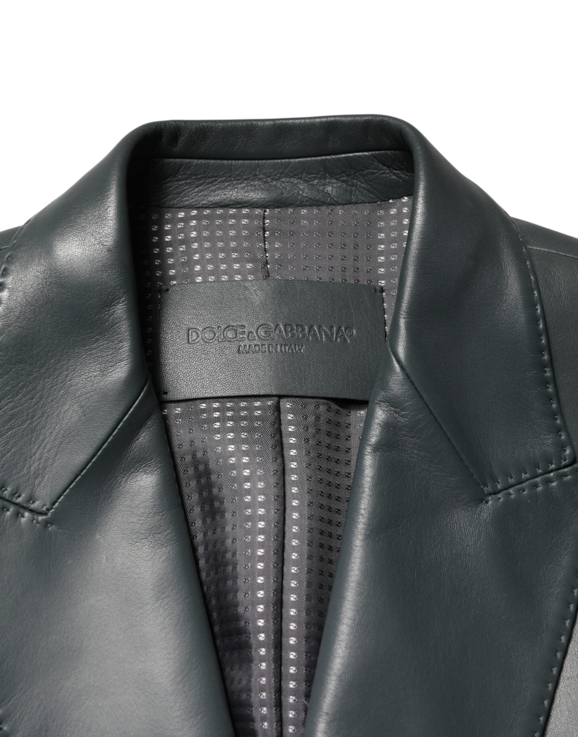 Experience the epitome of luxury with the Dolce & Gabbana Black Leather Double Breasted Blazer, a timeless masterpiece crafted in Italy for the discerning style connoisseur.